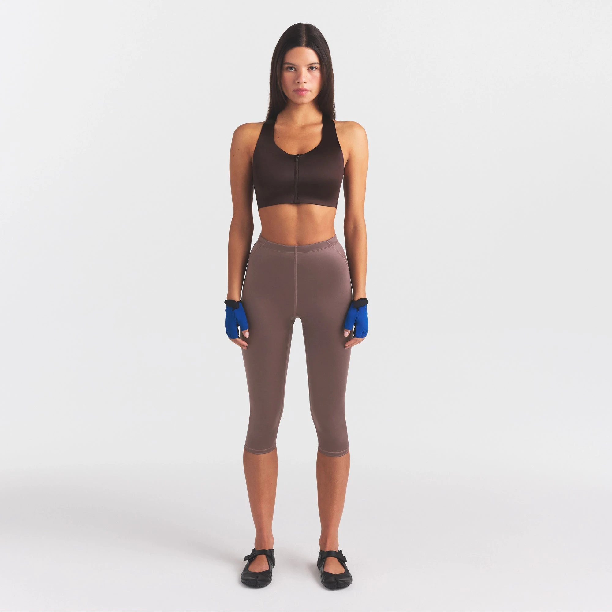 NikeSKIMS SATIN SHINE CAPRI 17" LEGGING | RESIN ON A MODEL FRONT VIEW