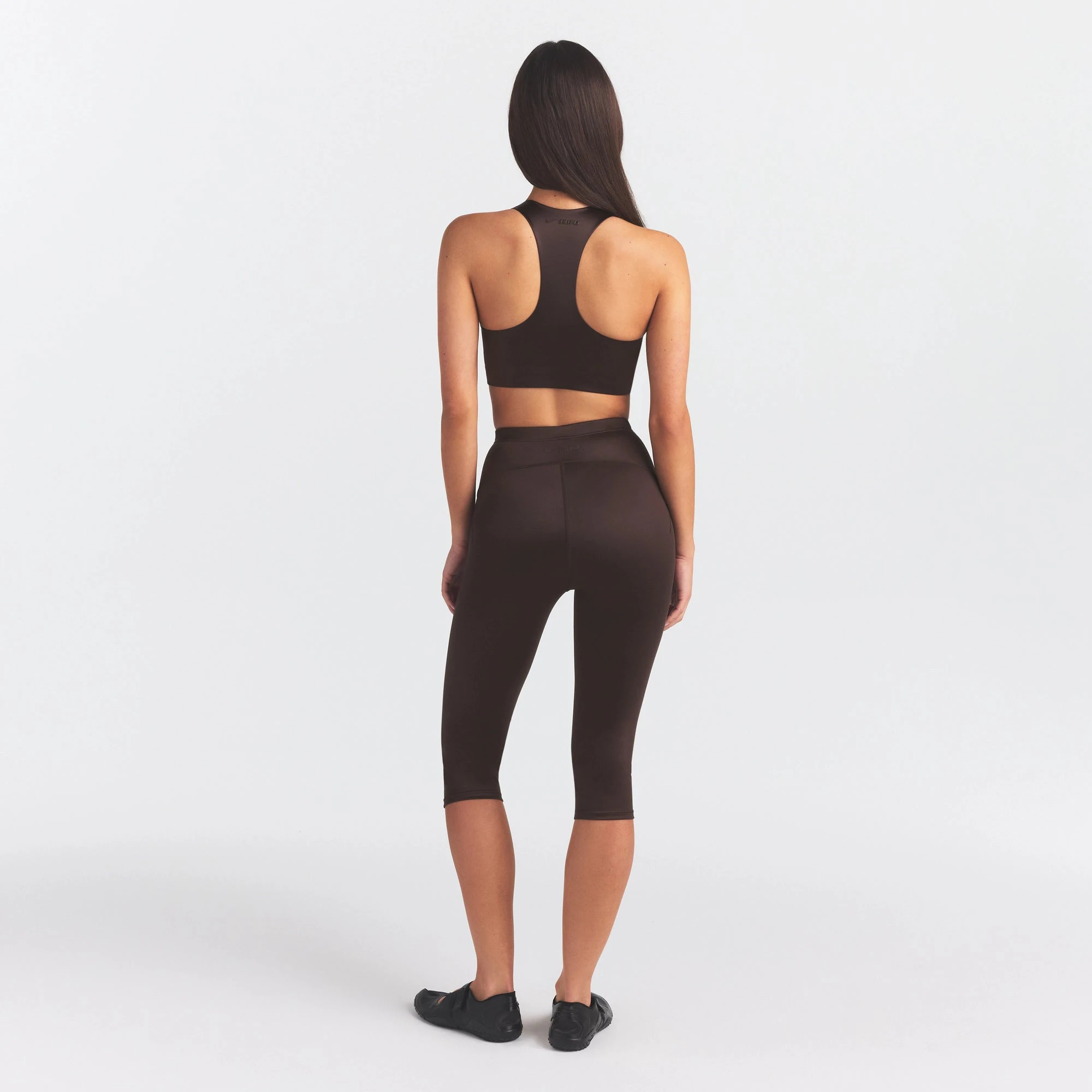 NikeSKIMS SATIN SHINE CAPRI 17" LEGGING | PHOENIX ON A MODEL FRONT VIEW