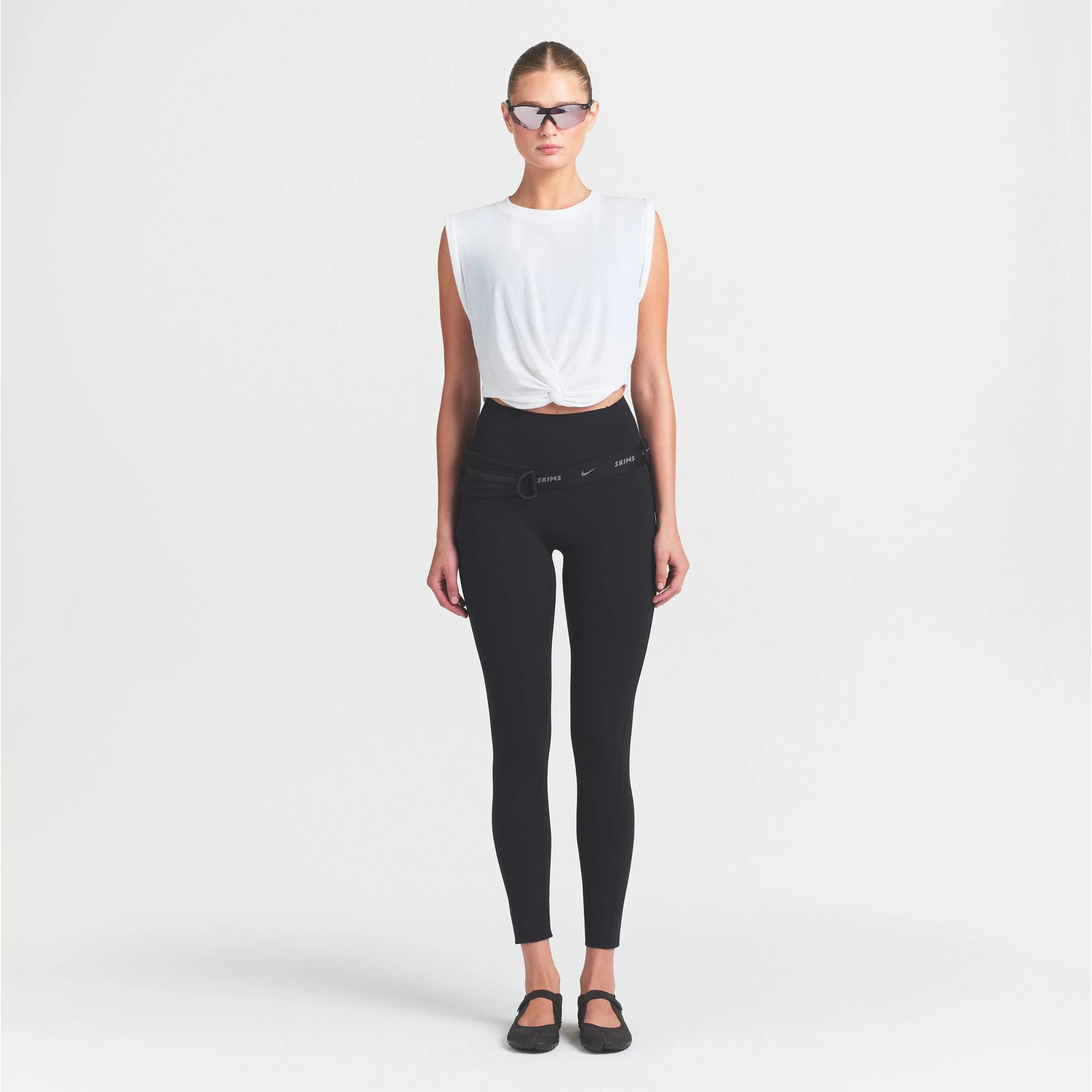 NikeSKIMS STUDIO STRETCH 26" LEGGING | OBSIDIAN ON A MODEL FRONT VIEW