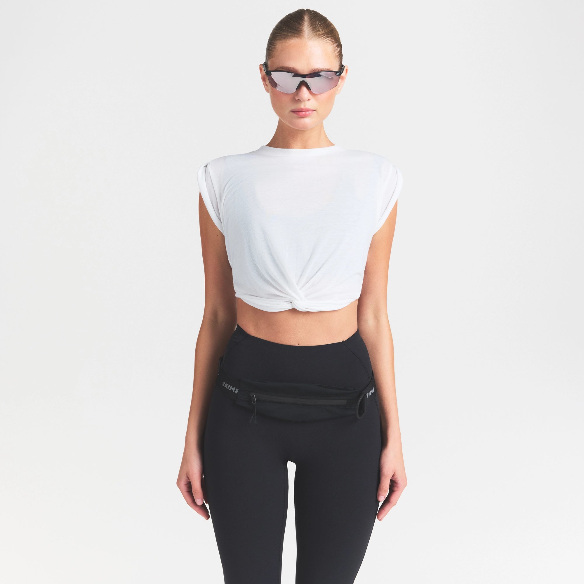 NikeSKIMS STUDIO STRETCH 26" LEGGING | OBSIDIAN ON A MODEL SIDE VIEW