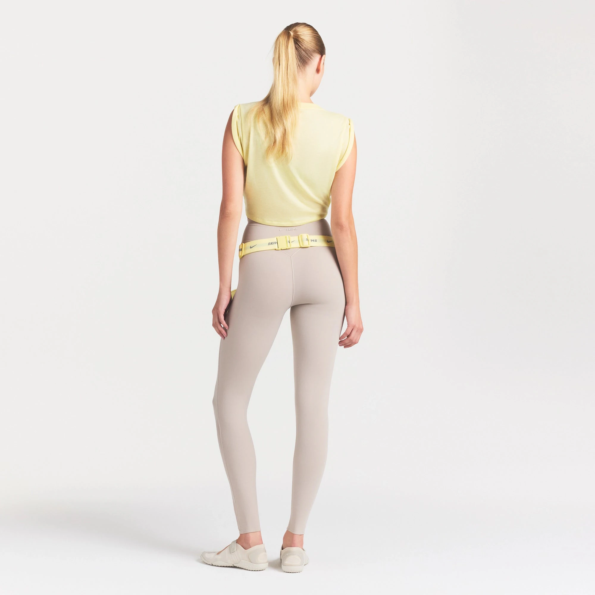 NikeSKIMS STUDIO STRETCH 26" LEGGING | LINEN ON A MODEL FRONT VIEW
