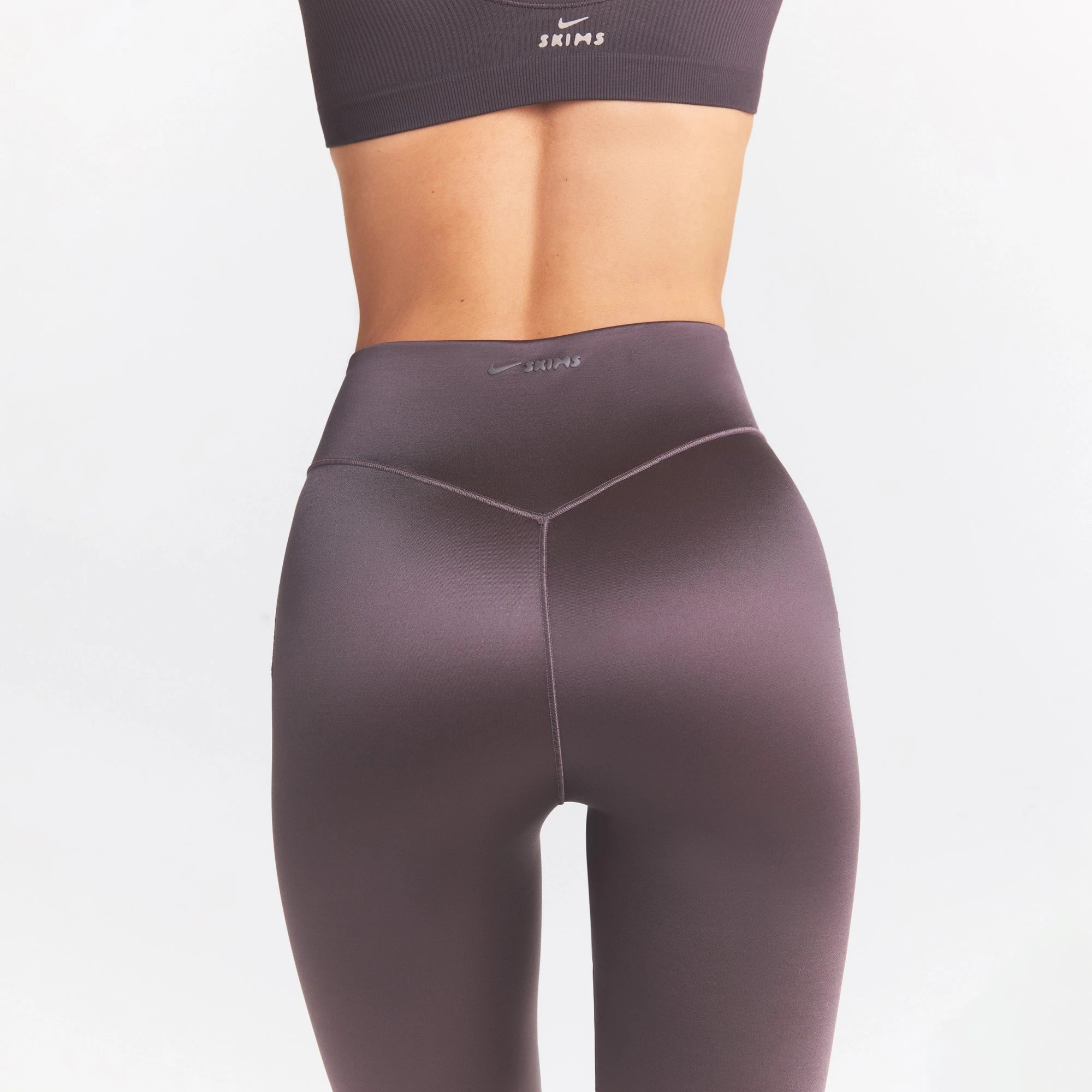 NikeSKIMS SATIN SHINE BONDED WAIST 29" LEGGING | RESIN ON A MODEL SIDE VIEW