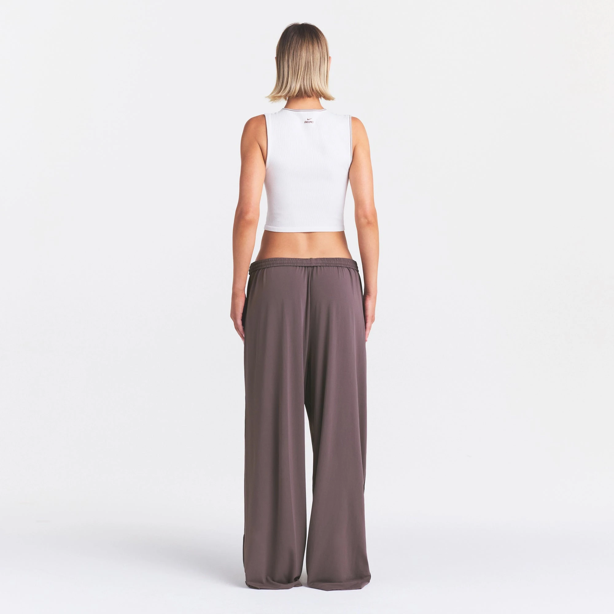 NikeSKIMS STRETCH KNIT WIDE LEG PANT | RESIN ON A MODEL FRONT VIEW @ | FOCUS: 0.0, 1.0, 0.9