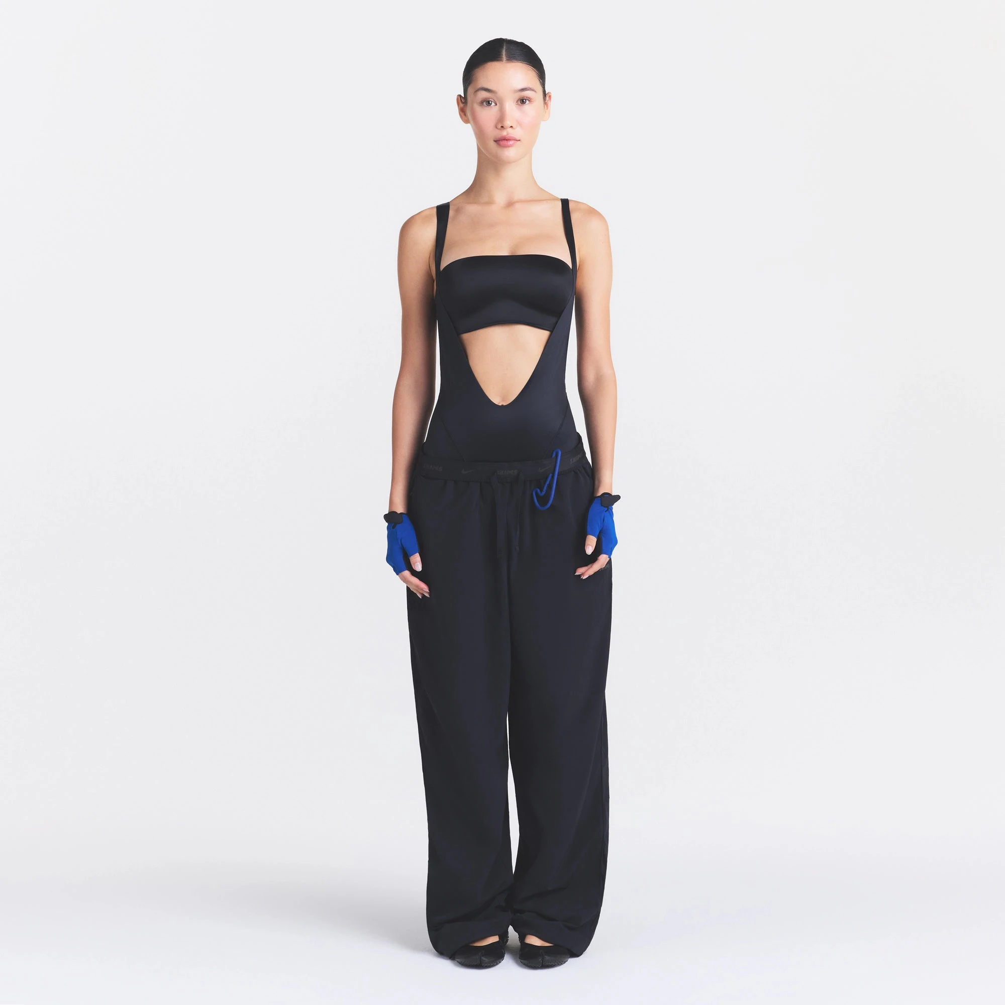 NikeSKIMS STRETCH NYLON OVERSIZED PANT | OBSIDIAN ON A MODEL FRONT VIEW