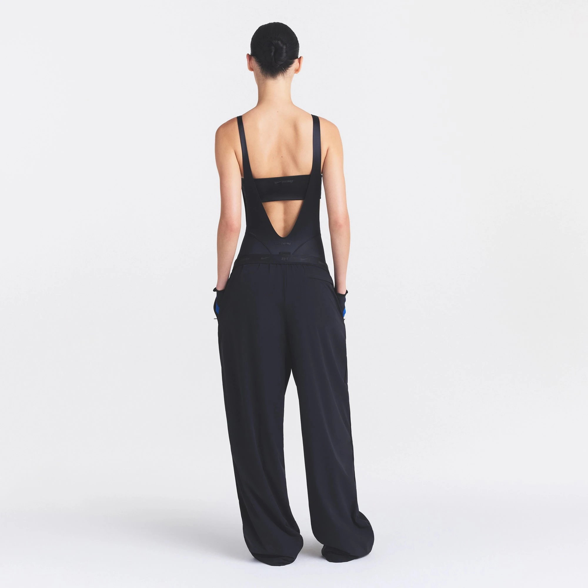 NikeSKIMS STRETCH NYLON OVERSIZED PANT | OBSIDIAN ON A MODEL FRONT VIEW