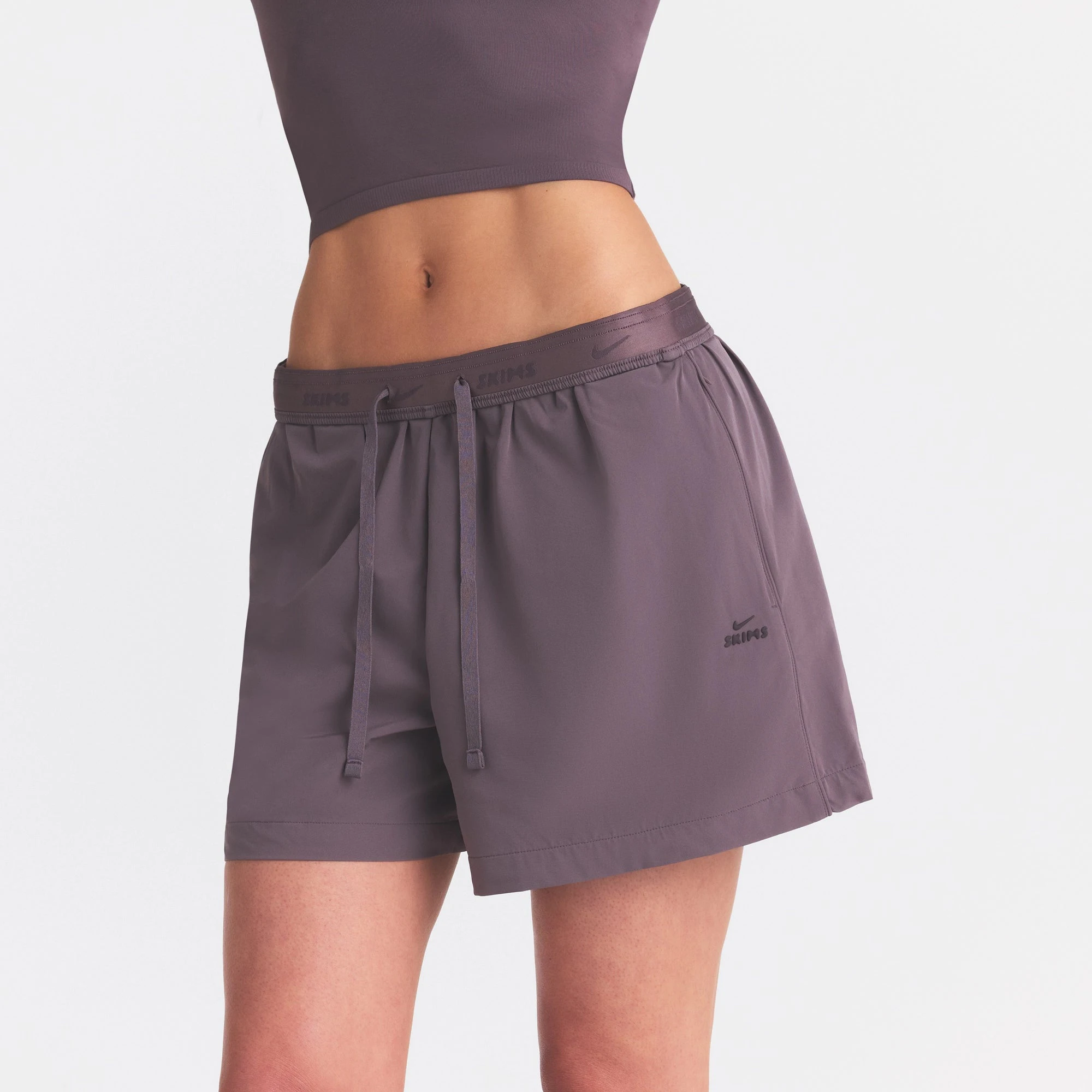 NikeSKIMS STRETCH NYLON 5" TRACK SHORT | RESIN ON A MODEL SIDE VIEW