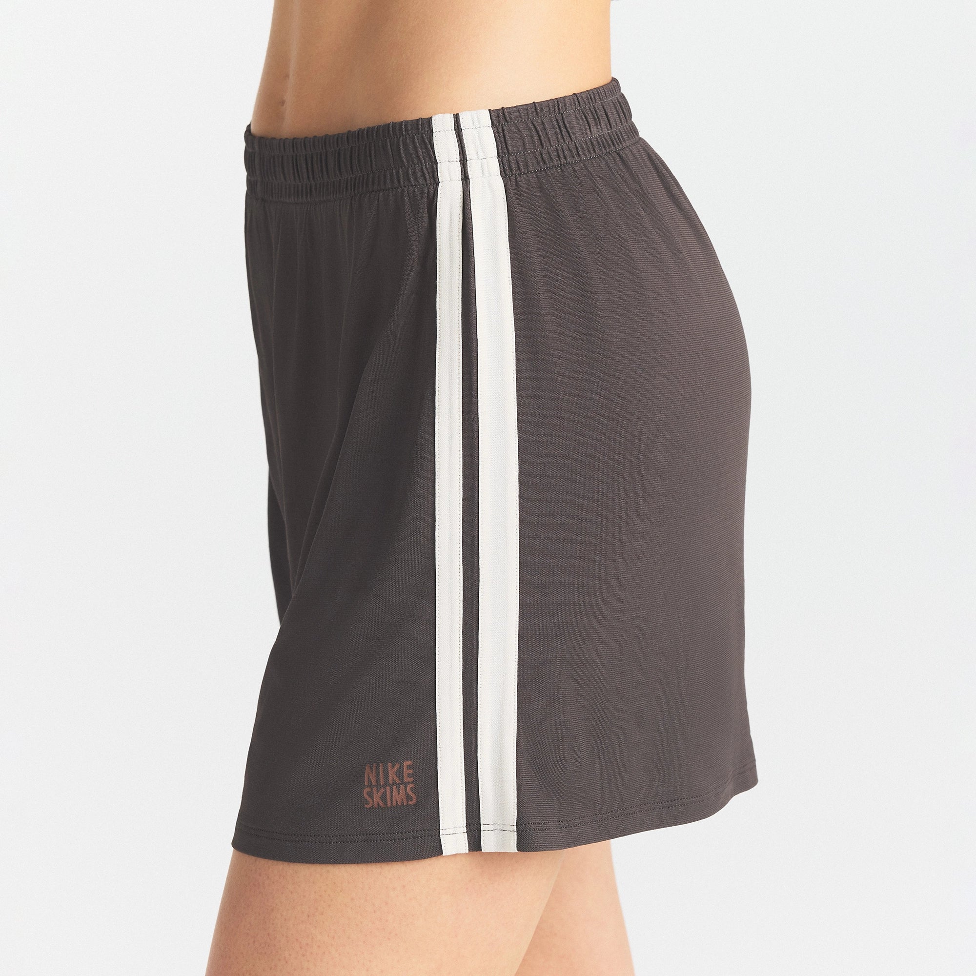 NikeSKIMS STRETCH KNIT SHORT | BOULDER/ECRU ON A MODEL SIDE VIEW @ | FOCUS: 0.0, 1.0, 0.9