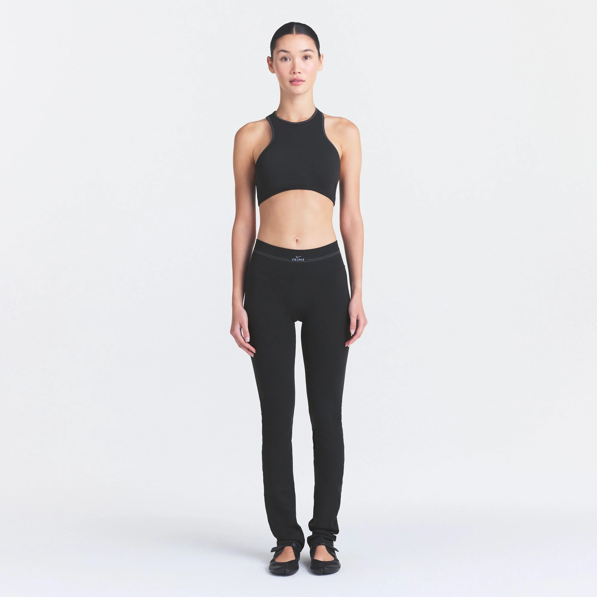 NikeSKIMS RIBBED SEAMLESS RACER FRONT BRA | OBSIDIAN ON A MODEL FRONT VIEW