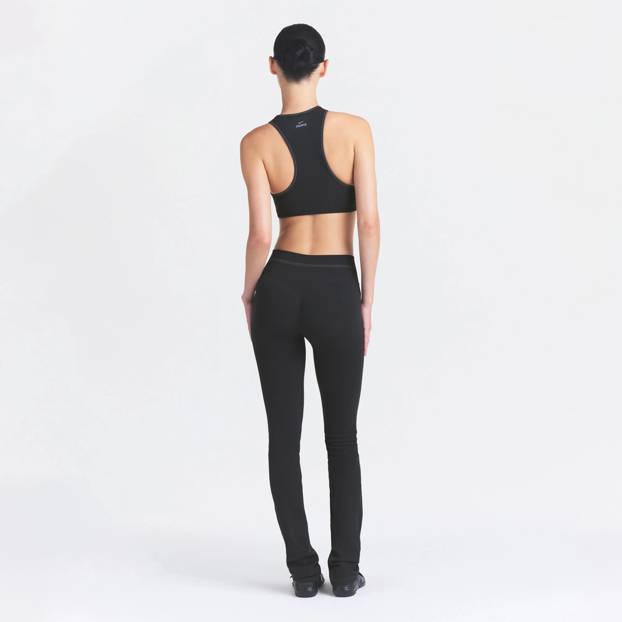 NikeSKIMS RIBBED SEAMLESS RACER FRONT BRA | OBSIDIAN ON A MODEL FRONT VIEW