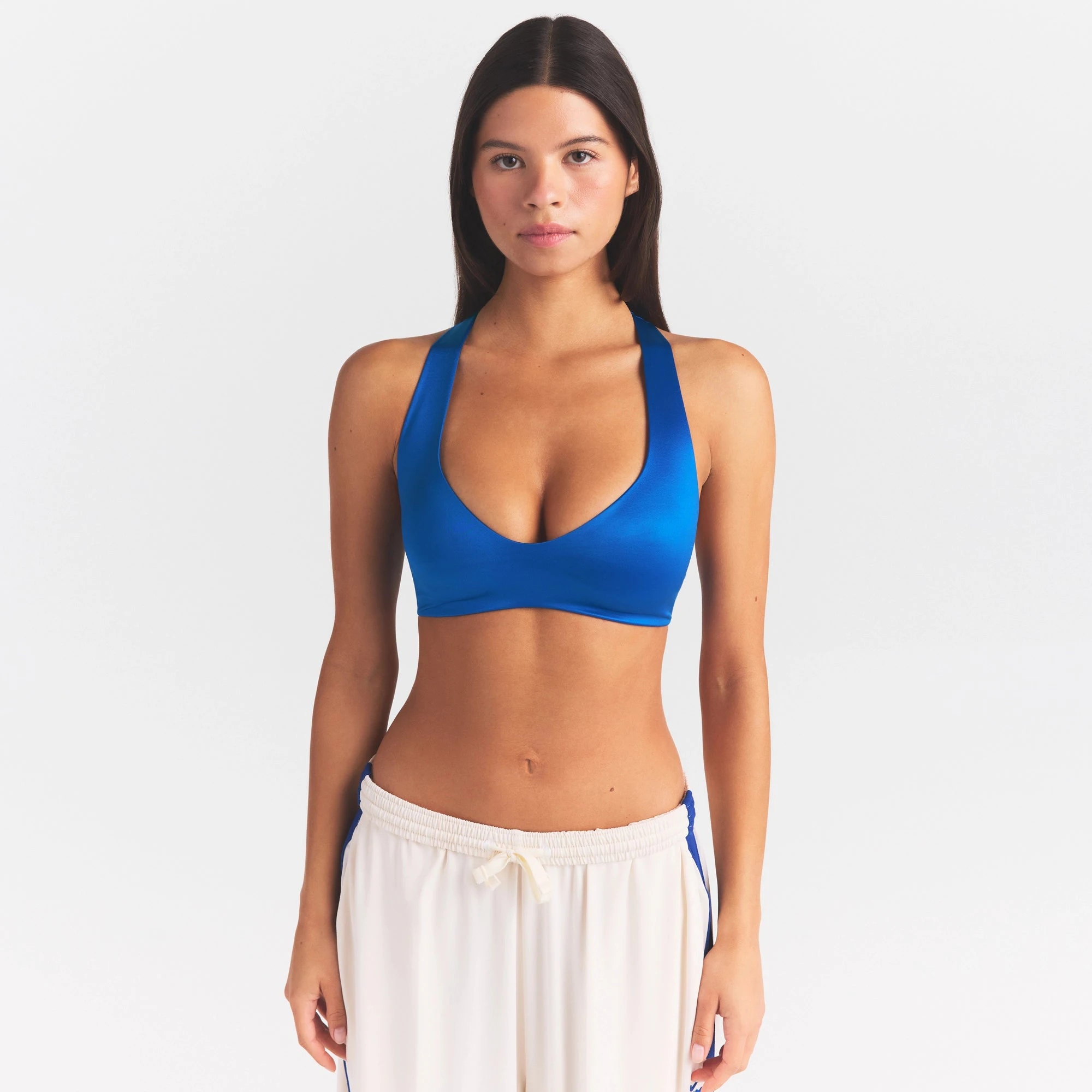 NikeSKIMS SATIN SHINE PLUNGE T-BACK BRA | COBALT ON A MODEL SIDE VIEW @ | FOCUS: 0.0, 1.0, 0.9