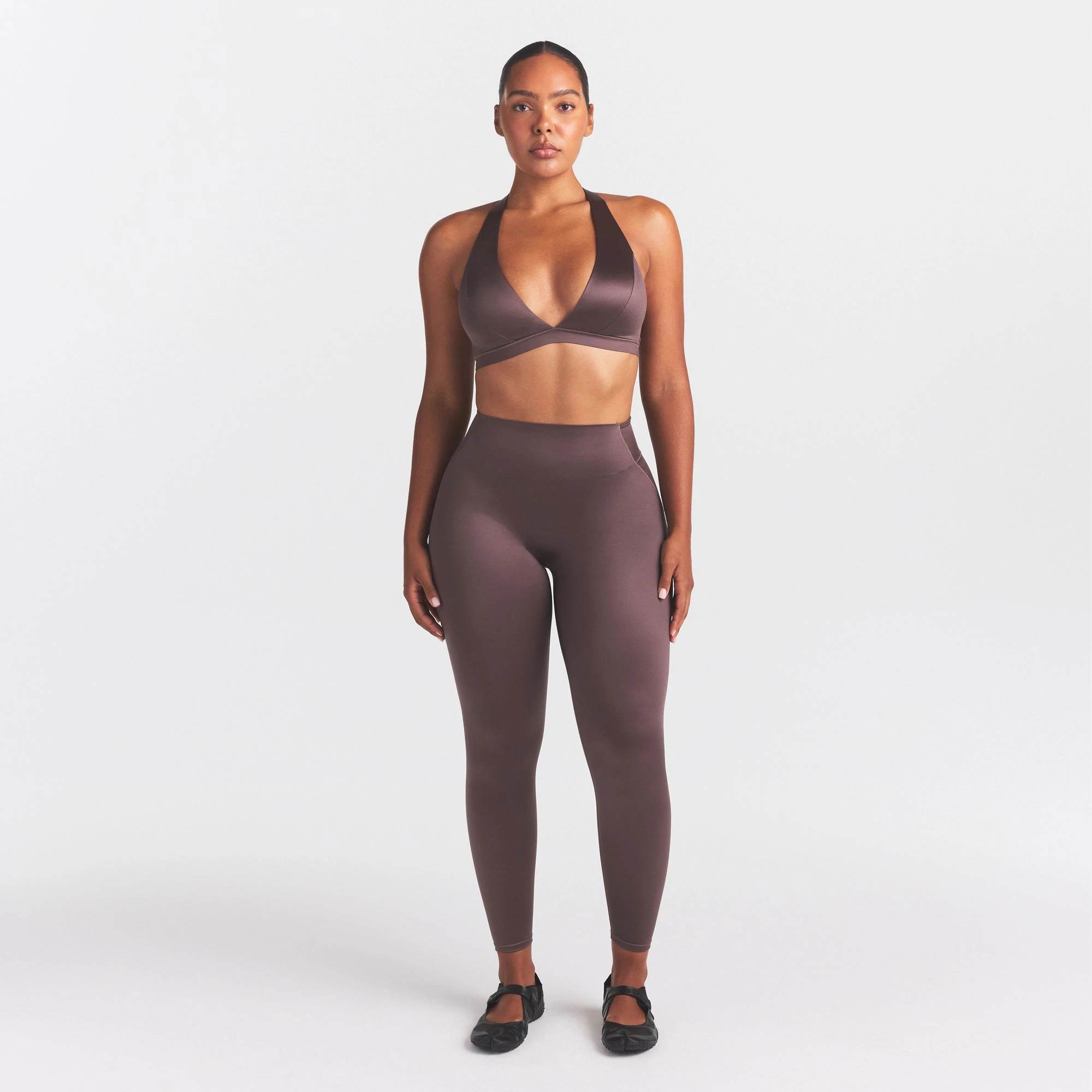NikeSKIMS SATIN SHINE RACERBACK BRA BRA | RESIN ON A MODEL FRONT VIEW @ | FOCUS: 0.0, 1.0, 0.9
