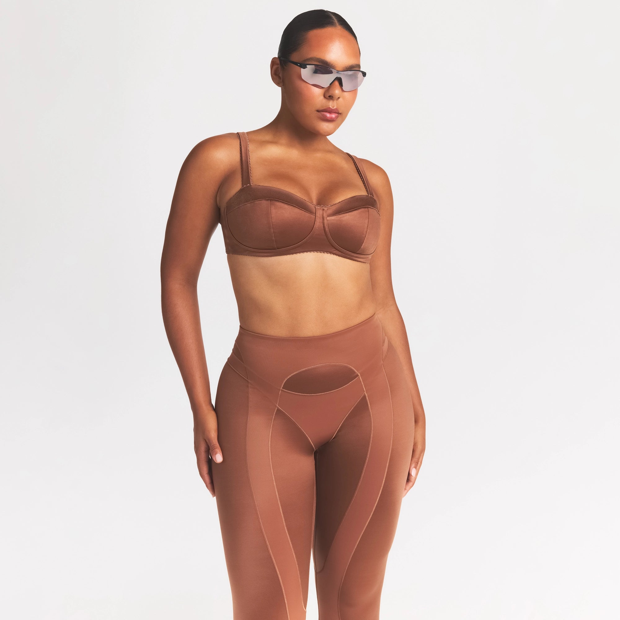 NikeSKIMS SATIN SHINE PANELED PICOT BRA | CAROB BROWN ON A MODEL SIDE VIEW @ | FOCUS: 0.0, 1.0, 0.9