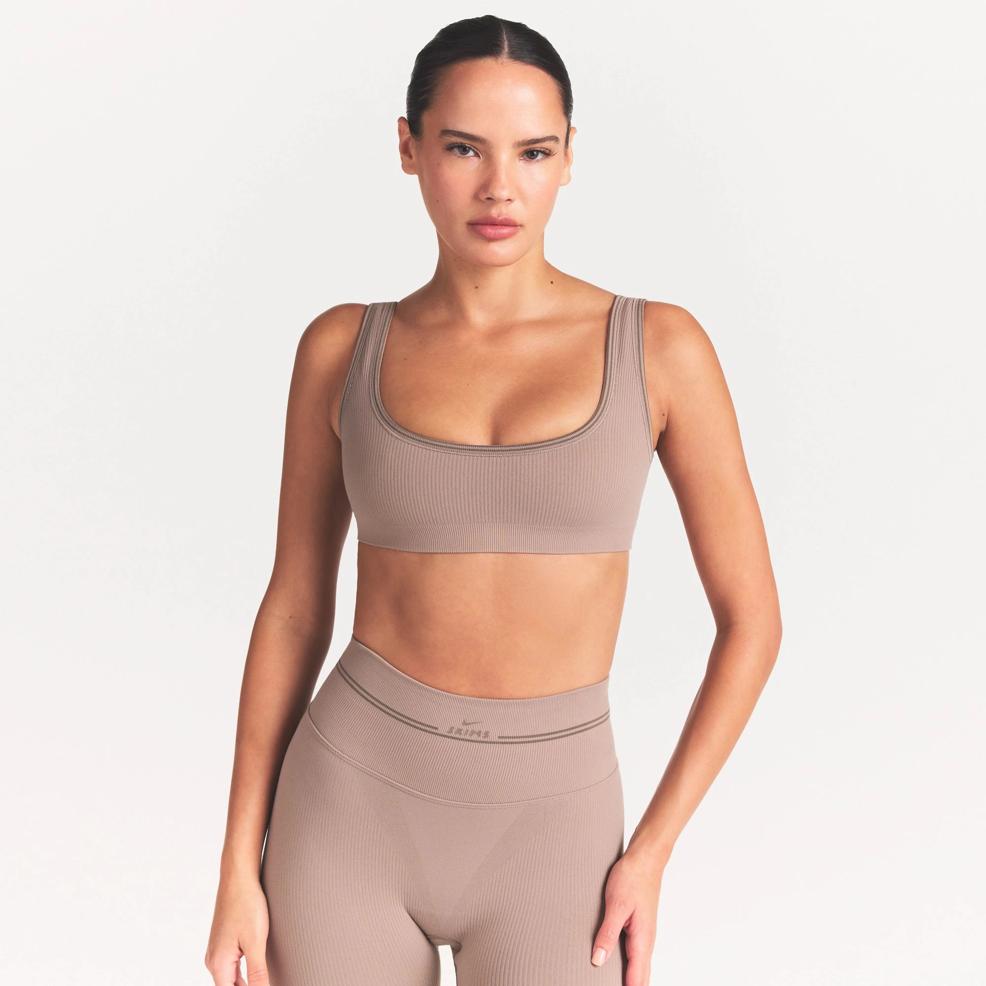 NikeSKIMS RIBBED SEAMLESS MICRO SCOOP BRA | DRIFTWOOD ON A MODEL SIDE VIEW @ | FOCUS: 0.0, 1.0, 0.9