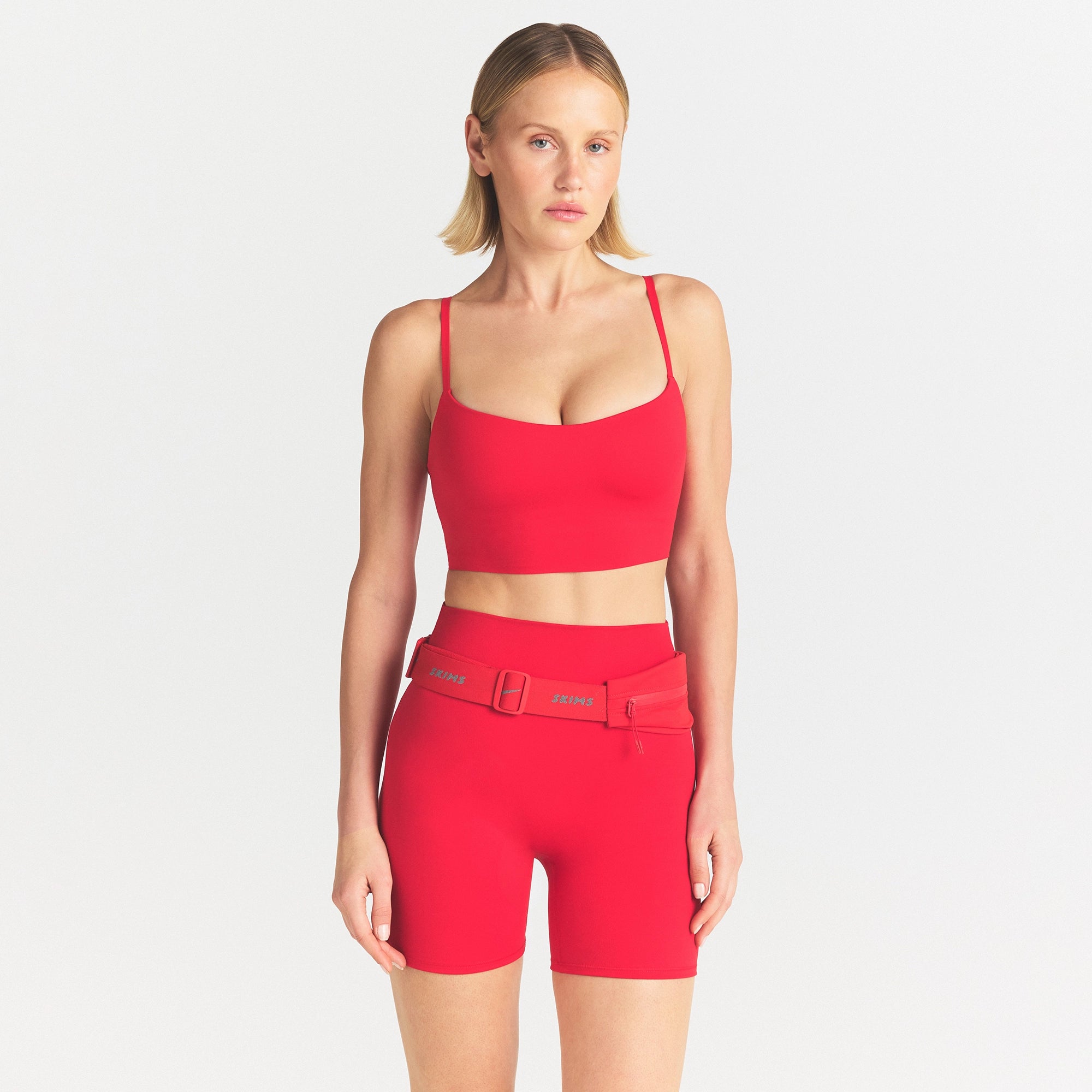 NikeSKIMS MATTE CAMI BRA TOP | UNIVERSITY RED ON A MODEL SIDE VIEW @ | FOCUS: 0.0, 1.0, 0.9