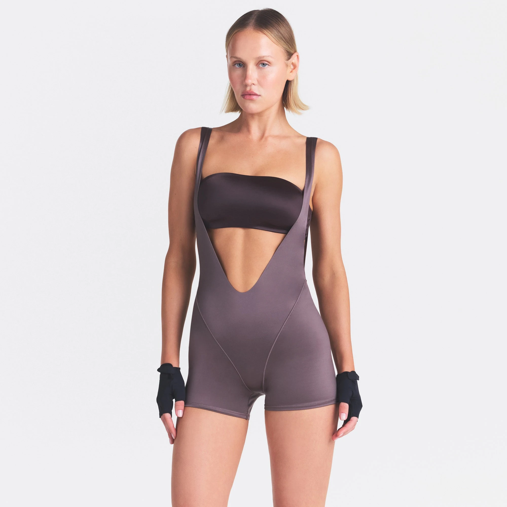 NikeSKIMS SATIN SHINE SUSPENDER 2.5" ONESIE | RESIN ON A MODEL SIDE VIEW