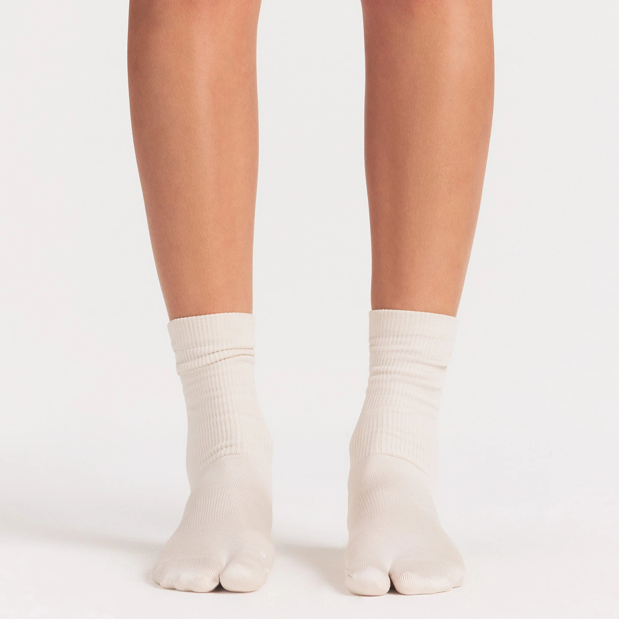 NikeSKIMS ACCESSORIES RIFT CREW SOCK | LIGHT OREWOOD BROWN ON A MODEL SIDE VIEW @ | FOCUS: 0.0, 1.0, 0.9