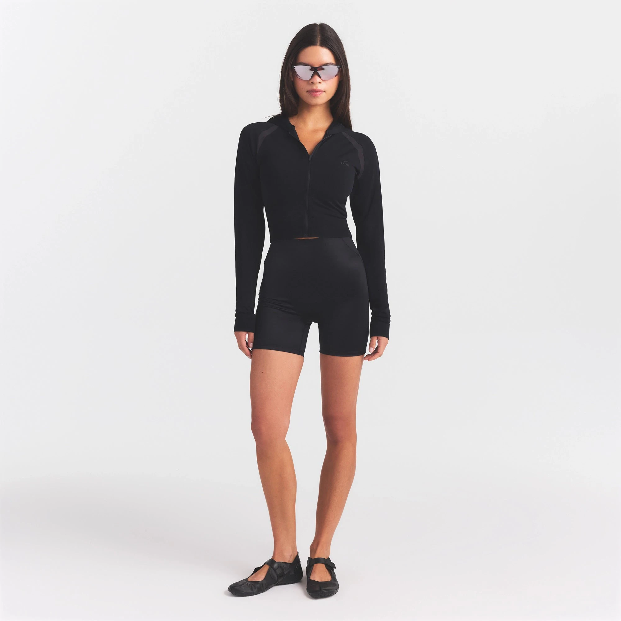 NikeSKIMS STRETCH KNIT SHRUNKEN ZIP HOODIE | OBSIDIAN ON A MODEL FRONT VIEW @ | FOCUS: 0.0, 1.0, 0.9
