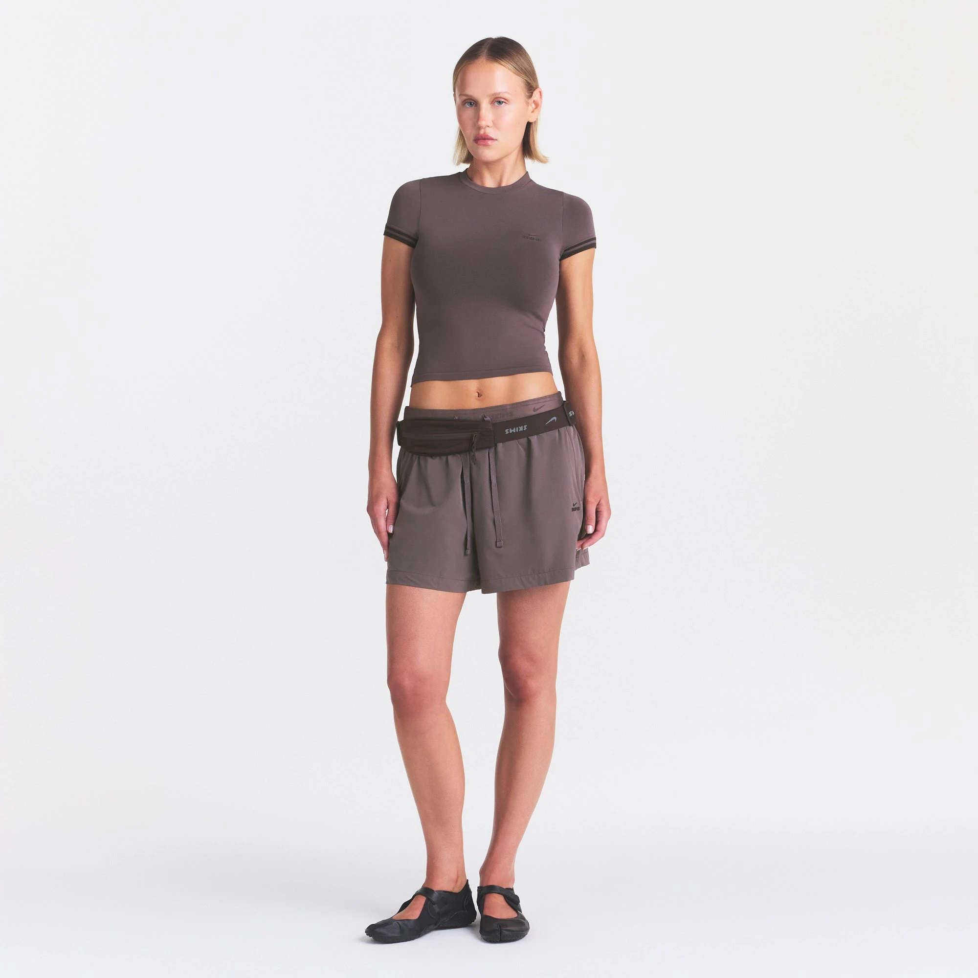 NikeSKIMS STRETCH KNIT CROPPED T-SHIRT | RESIN ON A MODEL FRONT VIEW @ | FOCUS: 0.0, 1.0, 0.9
