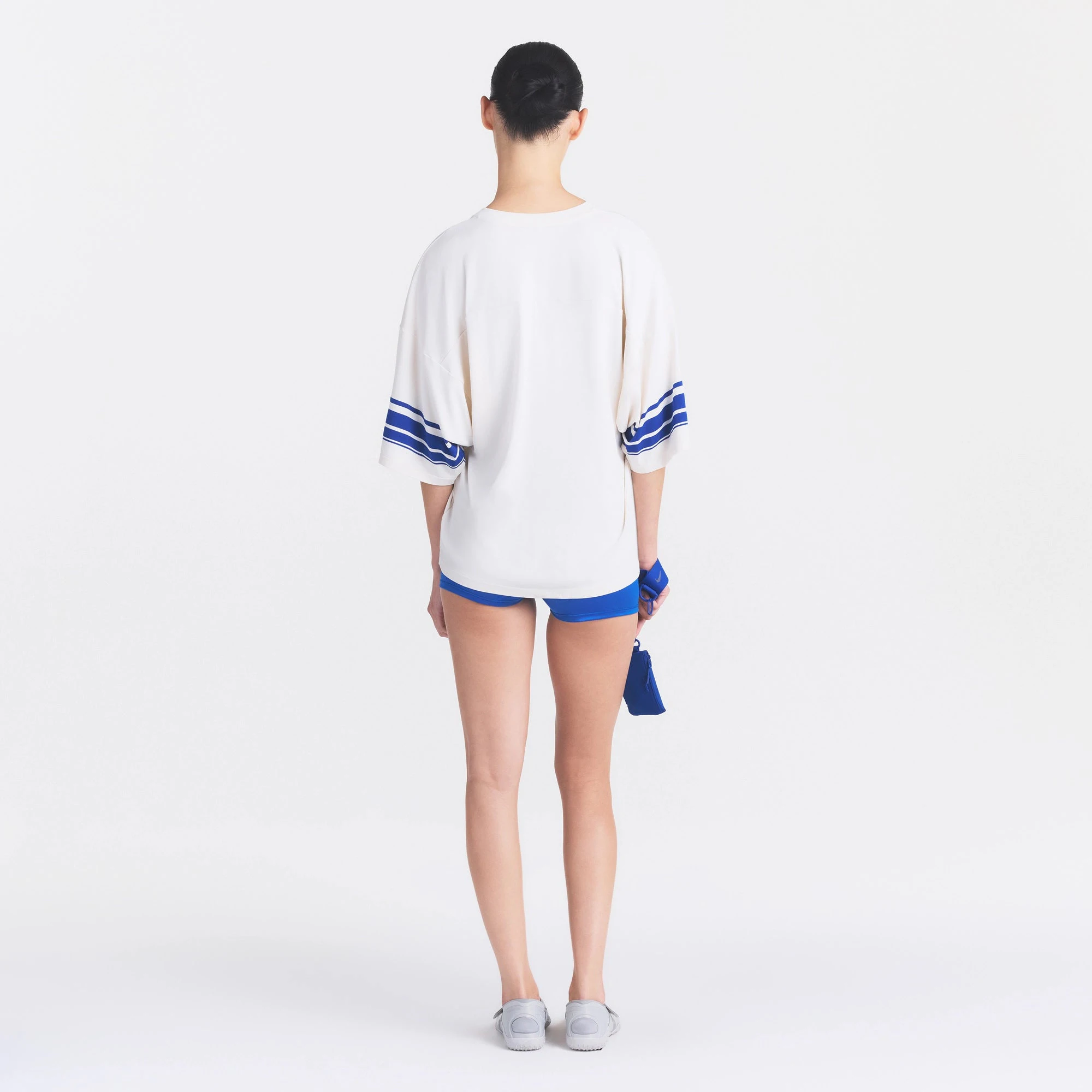 NikeSKIMS STRETCH KNIT OVERSIZED V-NECK TOP | IVORY ON A MODEL FRONT VIEW @ | FOCUS: 0.0, 1.0, 0.9