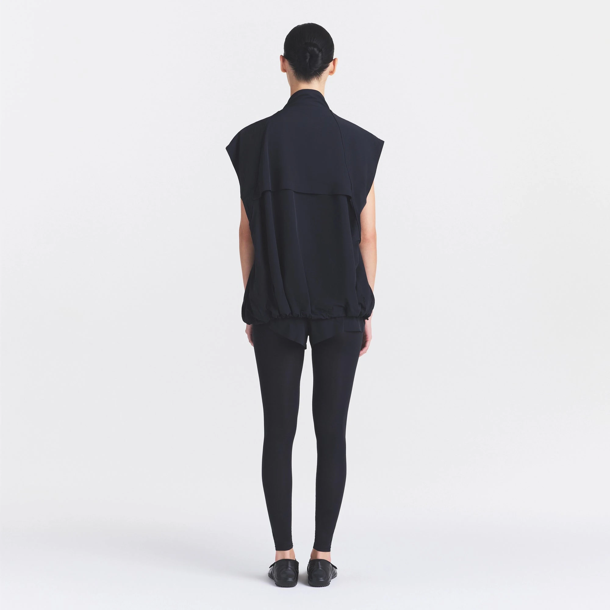 NikeSKIMS STRETCH NYLON OVERSIZED VEST | OBSIDIAN ON A MODEL FRONT VIEW @ | FOCUS: 0.0, 1.0, 0.9