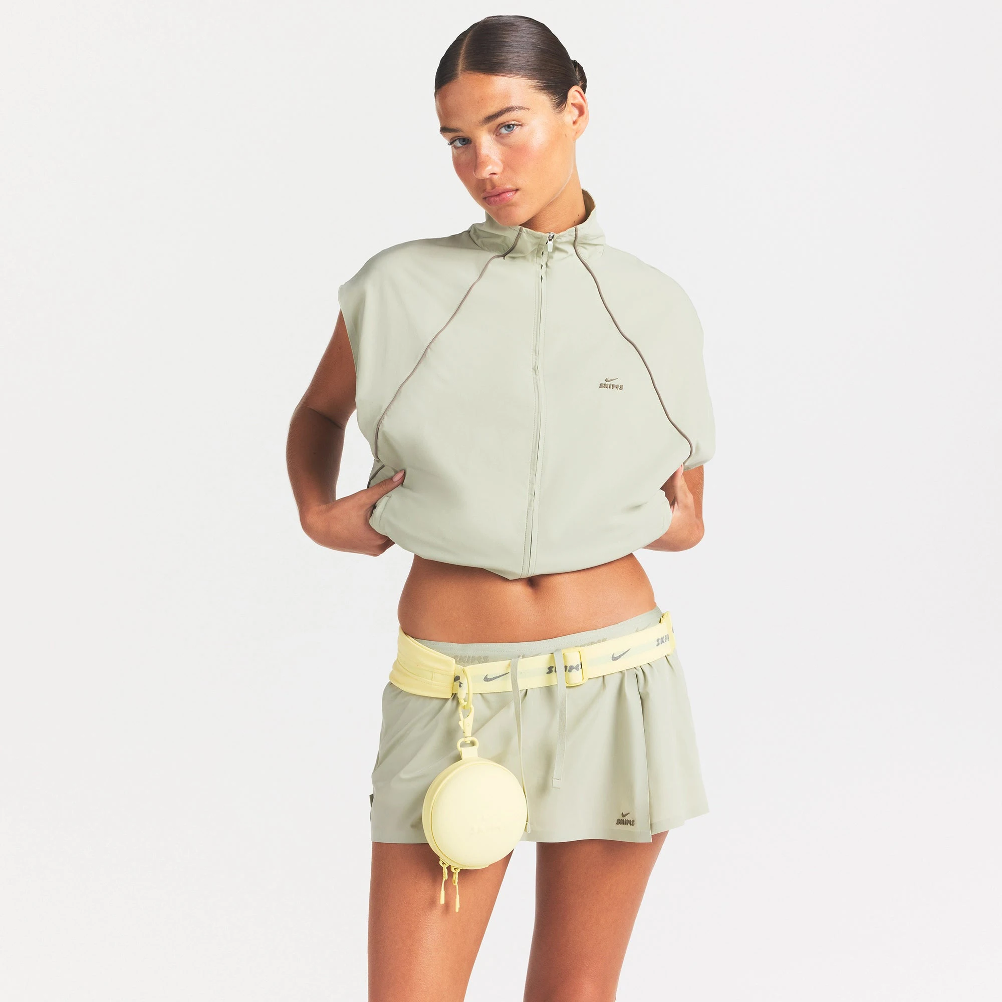 NikeSKIMS STRETCH NYLON OVERSIZED VEST | TALC ON A MODEL SIDE VIEW @ | FOCUS: 0.0, 1.0, 0.9