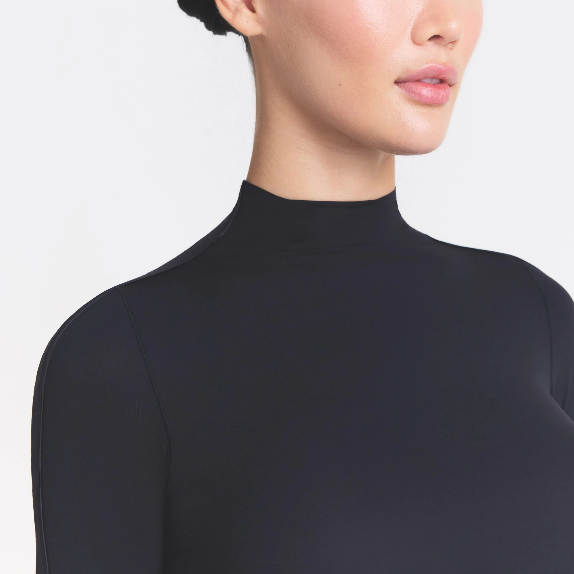 NikeSKIMS WEIGHTLESS LAYERS MOCK NECK SHORT SLEEVE T-SHIRT | OBSIDIAN ON A MODEL SIDE VIEW @ | FOCUS: 0.0, 1.0, 0.9