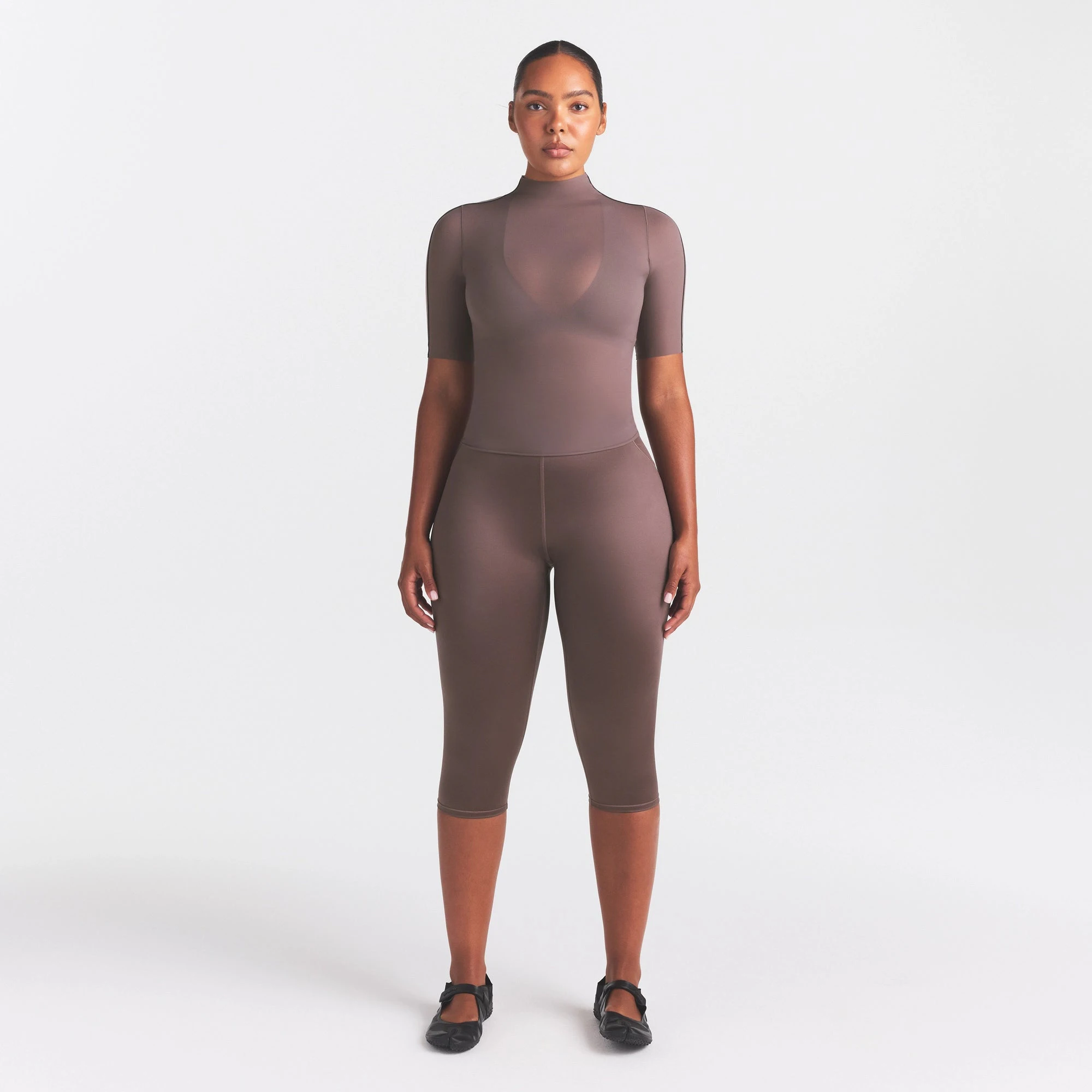 NikeSKIMS WEIGHTLESS LAYERS MOCK NECK SHORT SLEEVE T-SHIRT | RESIN ON A MODEL FRONT VIEW @ | FOCUS: 0.0, 1.0, 0.9