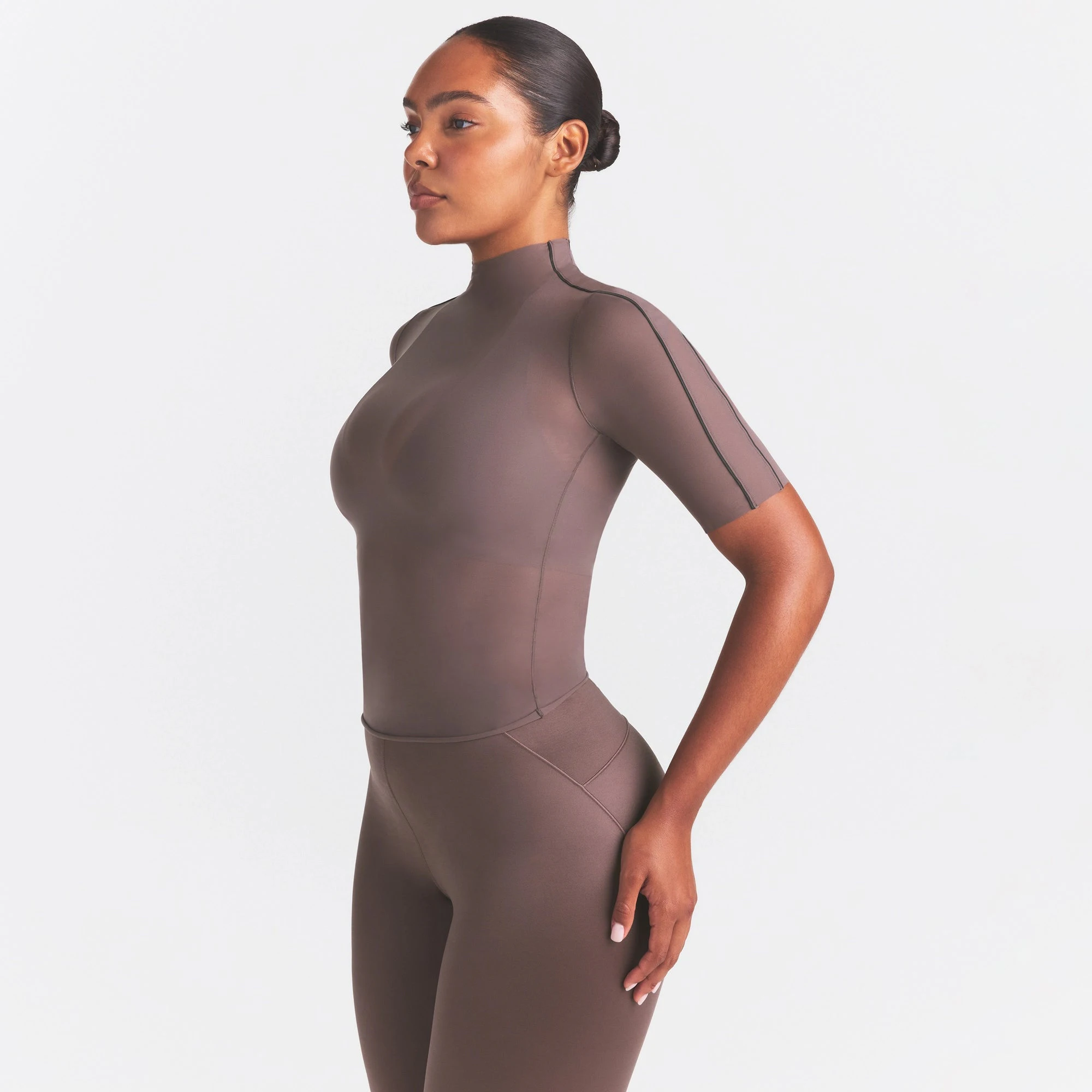 NikeSKIMS WEIGHTLESS LAYERS MOCK NECK SHORT SLEEVE T-SHIRT | RESIN ON A MODEL SIDE VIEW @ | FOCUS: 0.0, 1.0, 0.9
