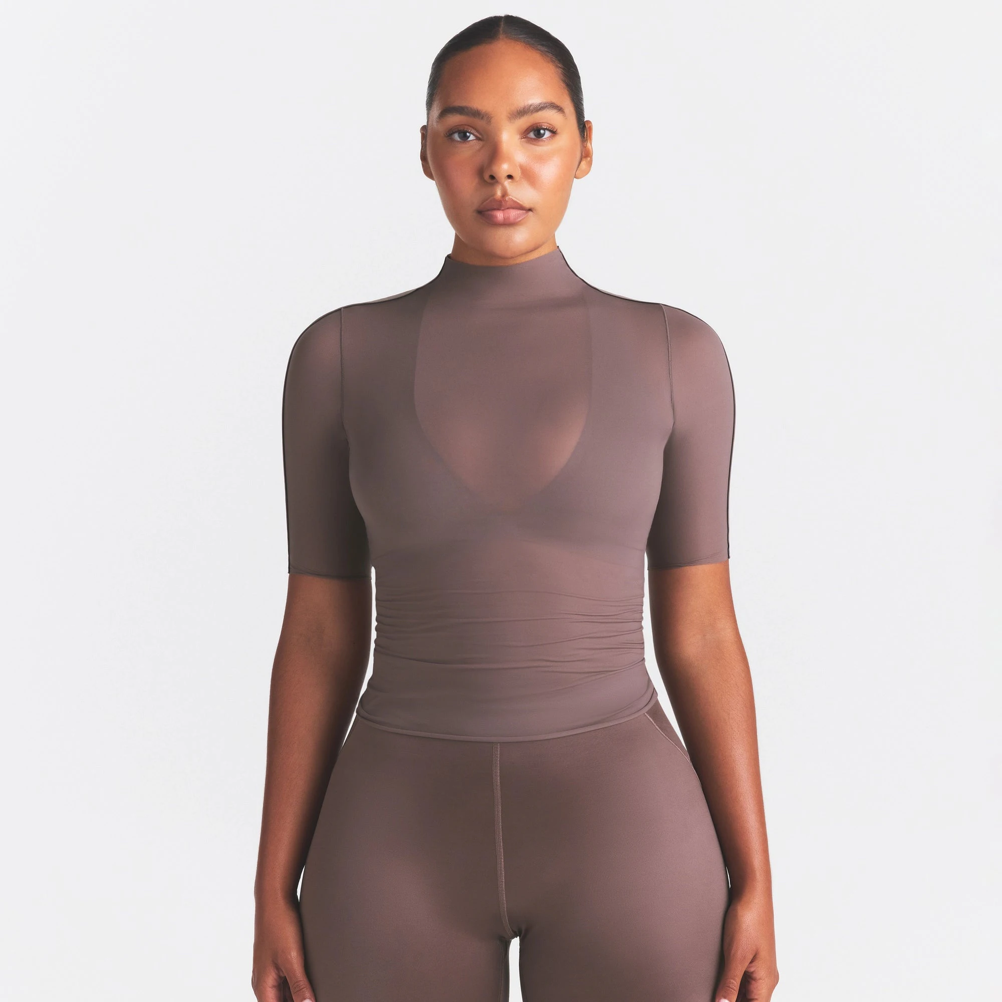 NikeSKIMS WEIGHTLESS LAYERS MOCK NECK SHORT SLEEVE T-SHIRT | RESIN ON A MODEL SIDE VIEW @ | FOCUS: 0.0, 1.0, 0.9