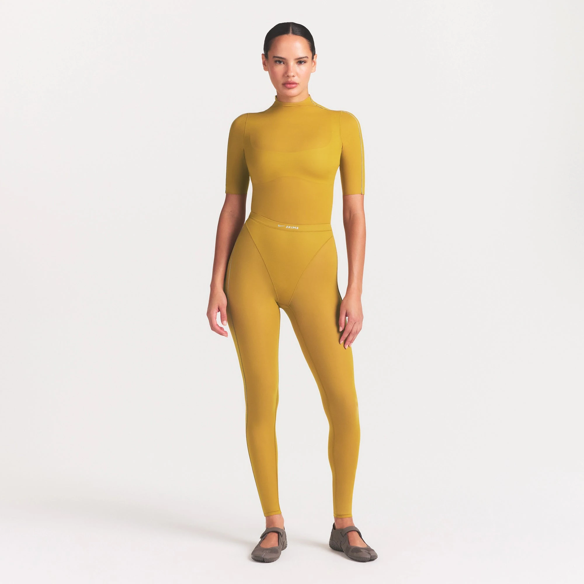 NikeSKIMS WEIGHTLESS LAYERS MOCK NECK SHORT SLEEVE T-SHIRT | CITRINE ON A MODEL FRONT VIEW @ | FOCUS: 0.0, 1.0, 0.9