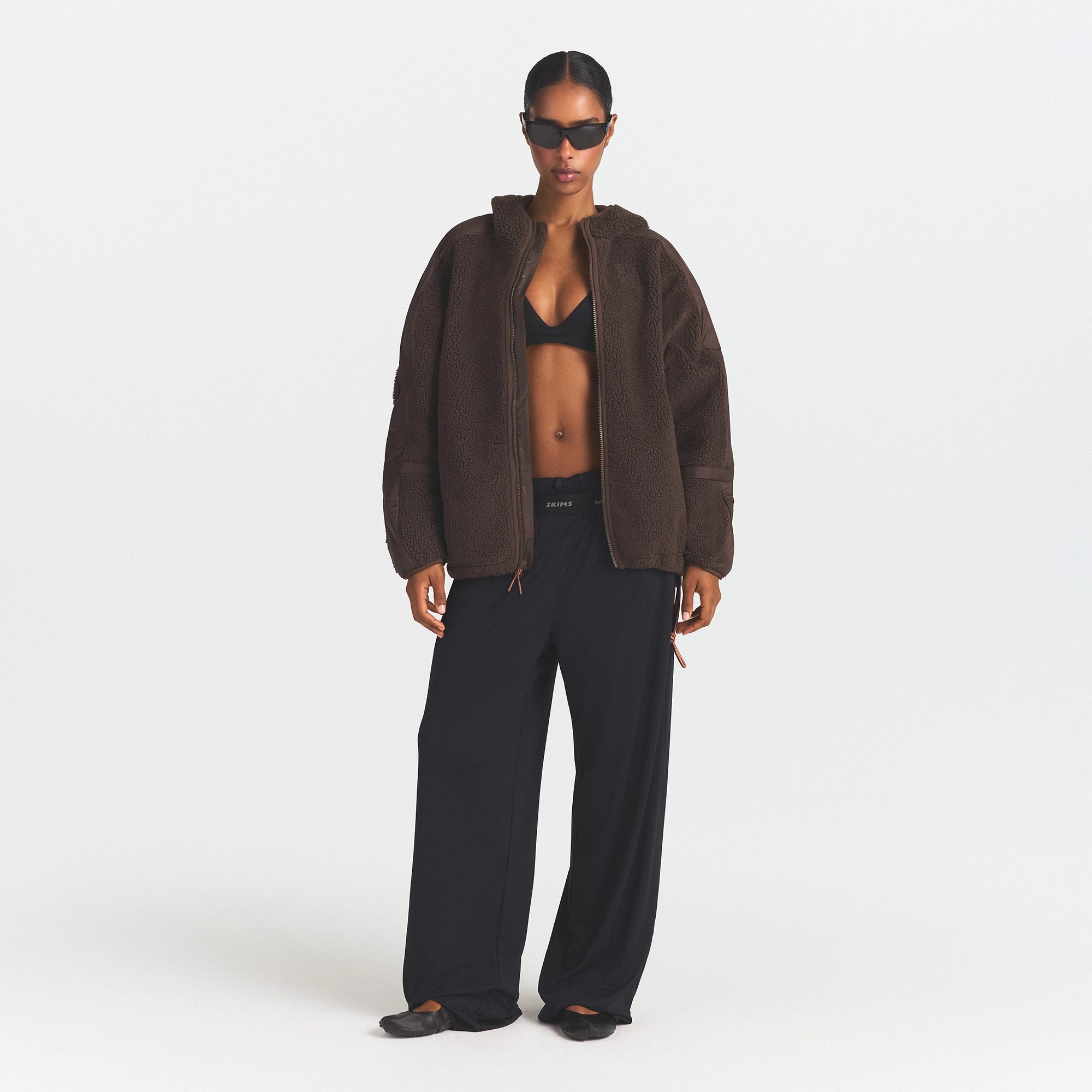 NikeSKIMS SHERPA HOODED JACKET | DARK SEPIA ON A MODEL FRONT VIEW @ | FOCUS: 0.0, 1.0, 0.9