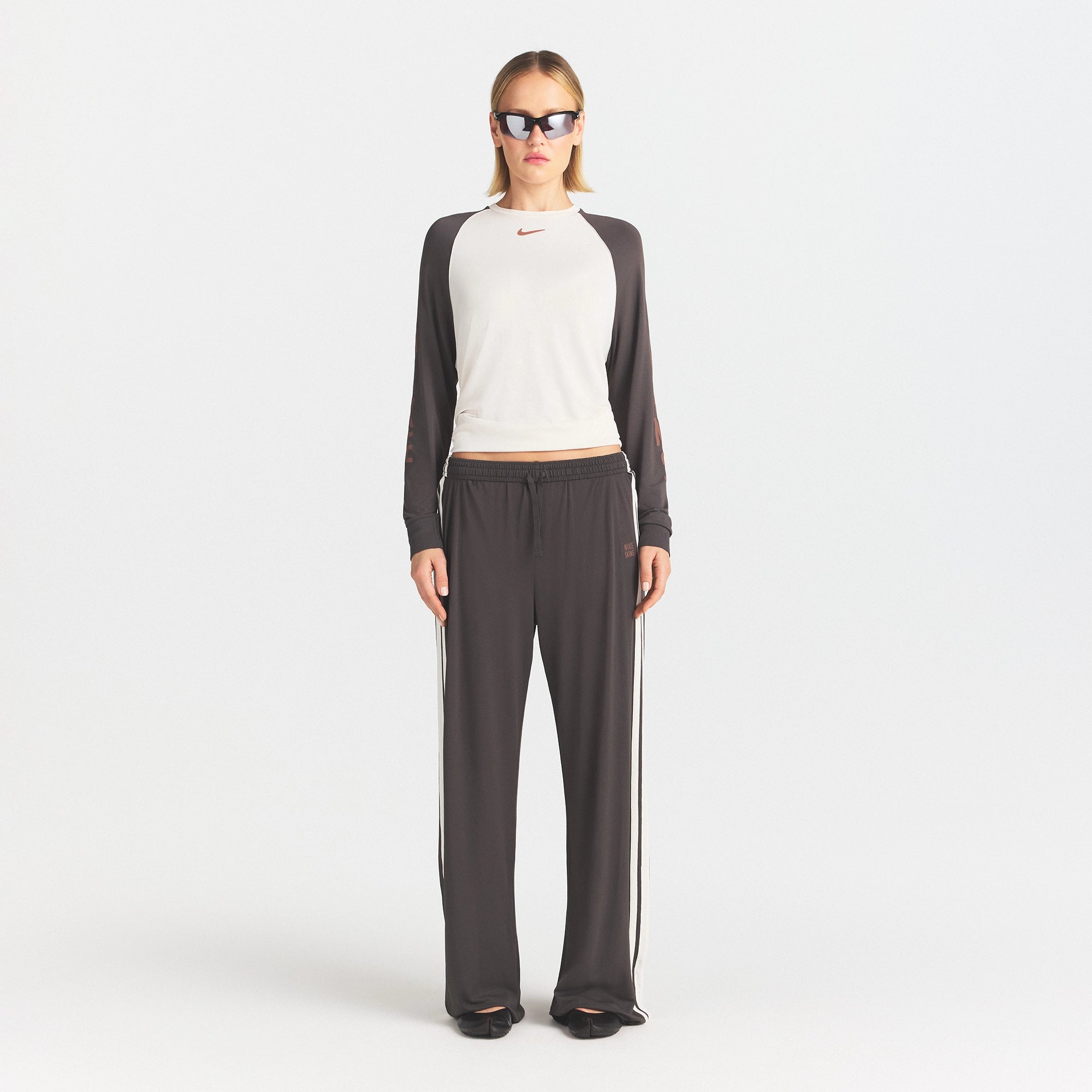 NikeSKIMS STRETCH KNIT OVERSIZED LONG SLEEVE TOP | ECRU/BOULDER ON A MODEL FRONT VIEW @ | FOCUS: 0.0, 1.0, 0.9