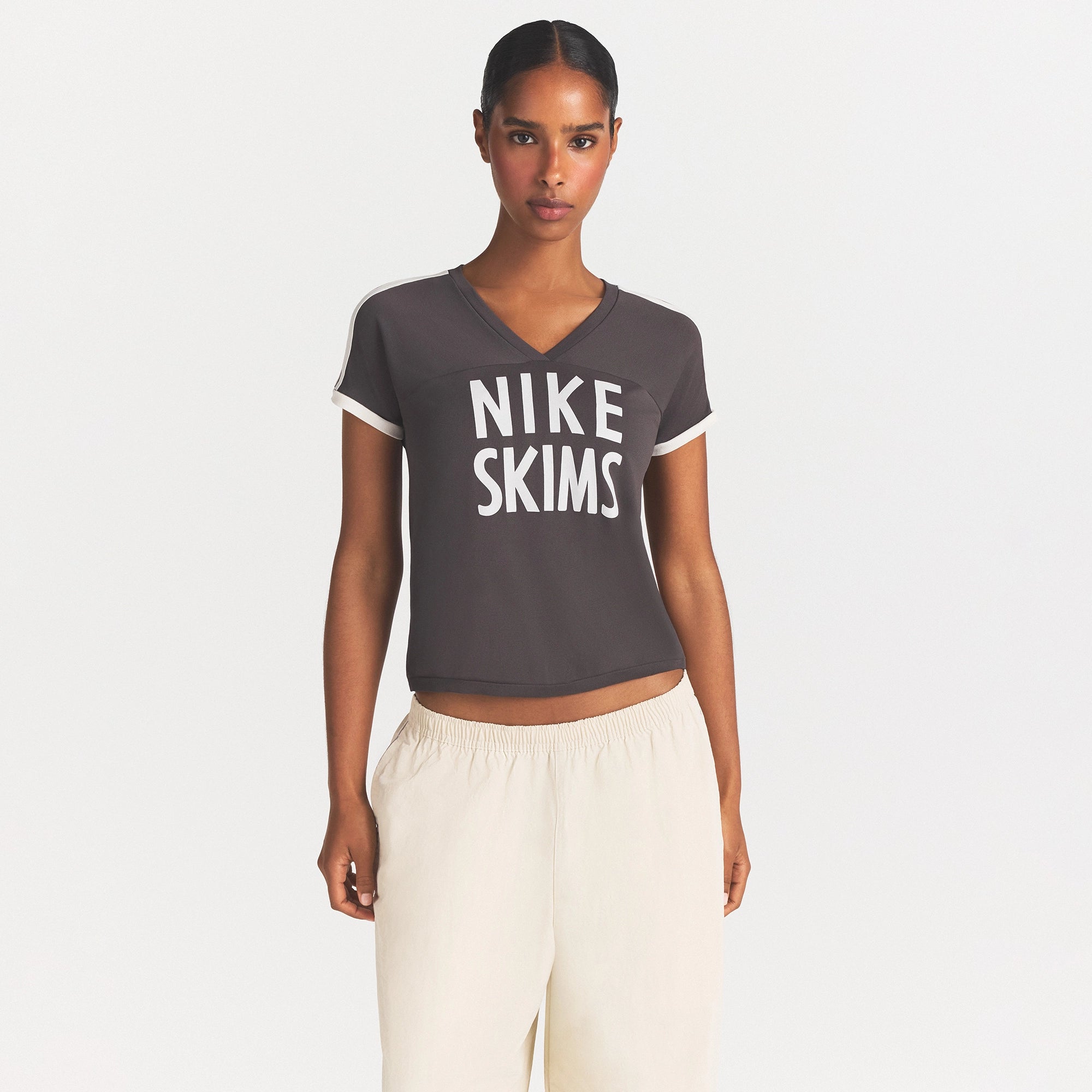 NikeSKIMS STRETCH KNIT SHORT SLEEVE TOP | BOULDER/ECRU ON A MODEL SIDE VIEW @ | FOCUS: 0.0, 1.0, 0.9