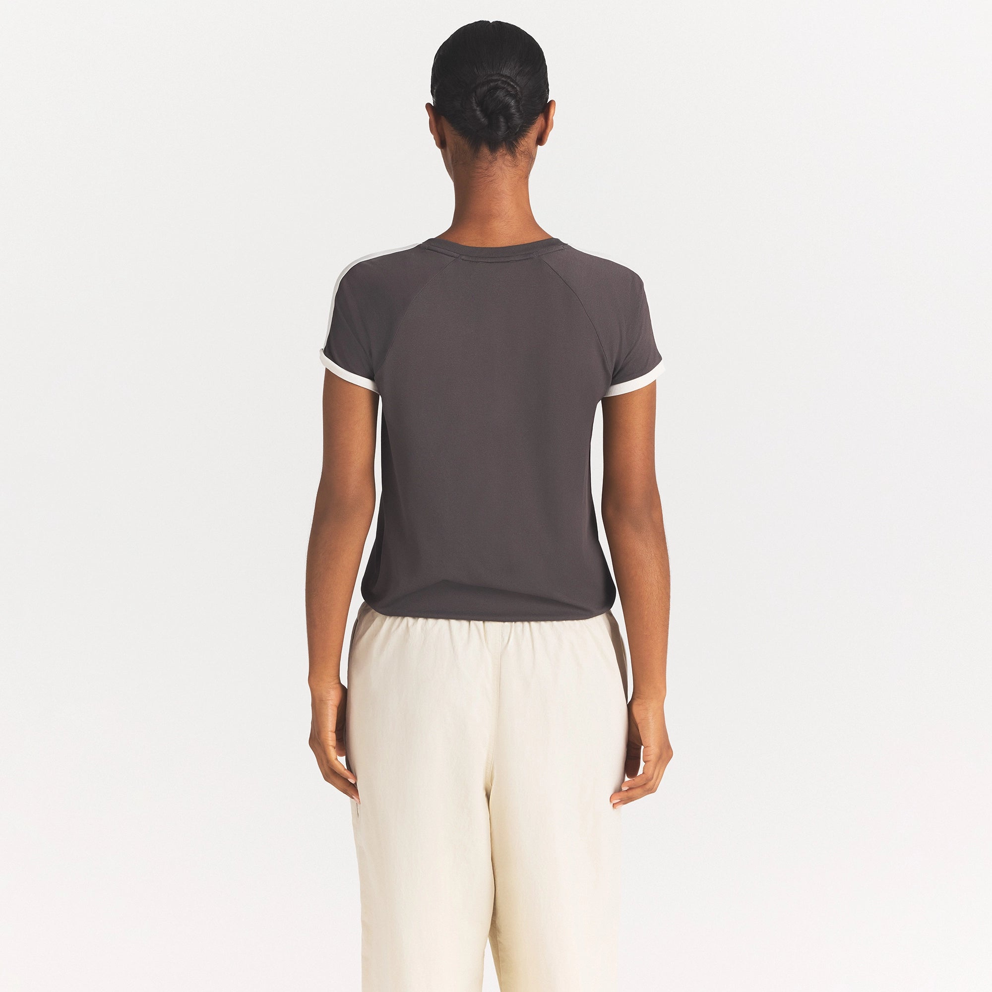 NikeSKIMS STRETCH KNIT SHORT SLEEVE TOP | BOULDER/ECRU ON A MODEL SIDE VIEW @ | FOCUS: 0.0, 1.0, 0.9