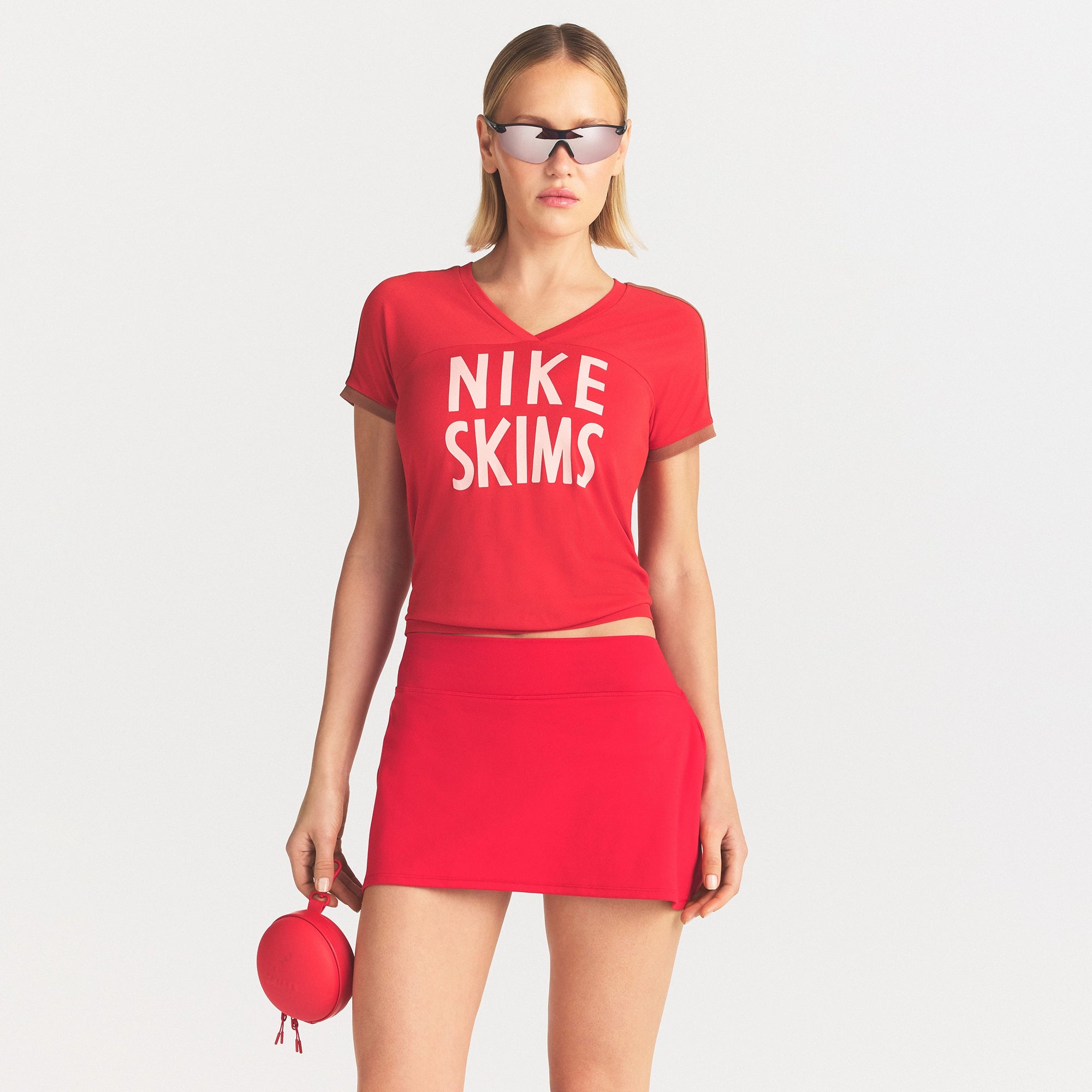 NikeSKIMS STRETCH KNIT SHORT SLEEVE TOP | SPORT RED/CAROB BROWN ON A MODEL SIDE VIEW @ | FOCUS: 0.0, 1.0, 0.9