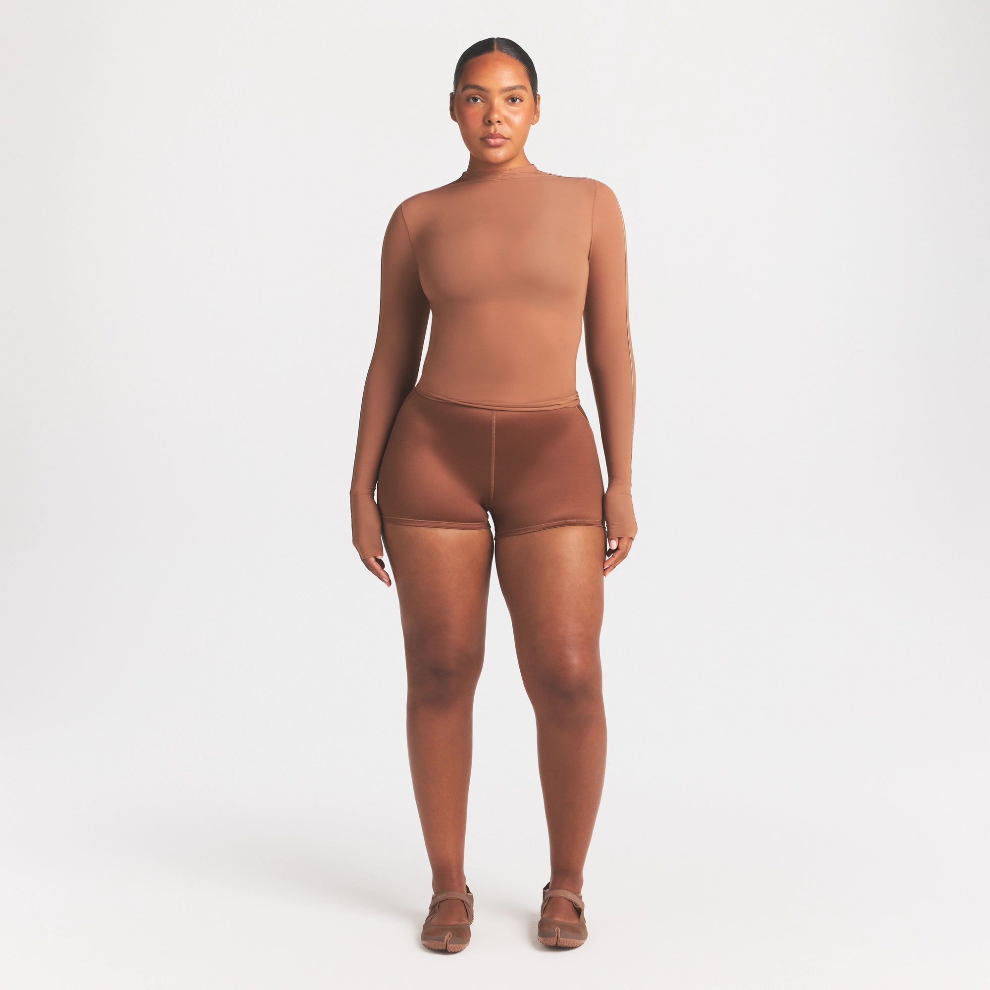 NikeSKIMS WEIGHTLESS LAYERS MOCK NECK LONG SLEEVE TOP | CAROB BRN ON A MODEL FRONT VIEW @ | FOCUS: 0.0, 1.0, 0.9