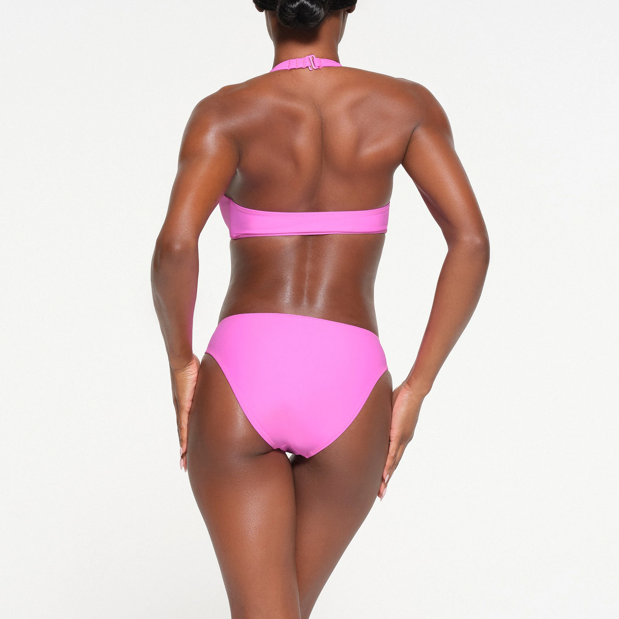 SIGNATURE SWIM HALTER MONOKINI | NEON ORCHID ON A MODEL BACK VIEW