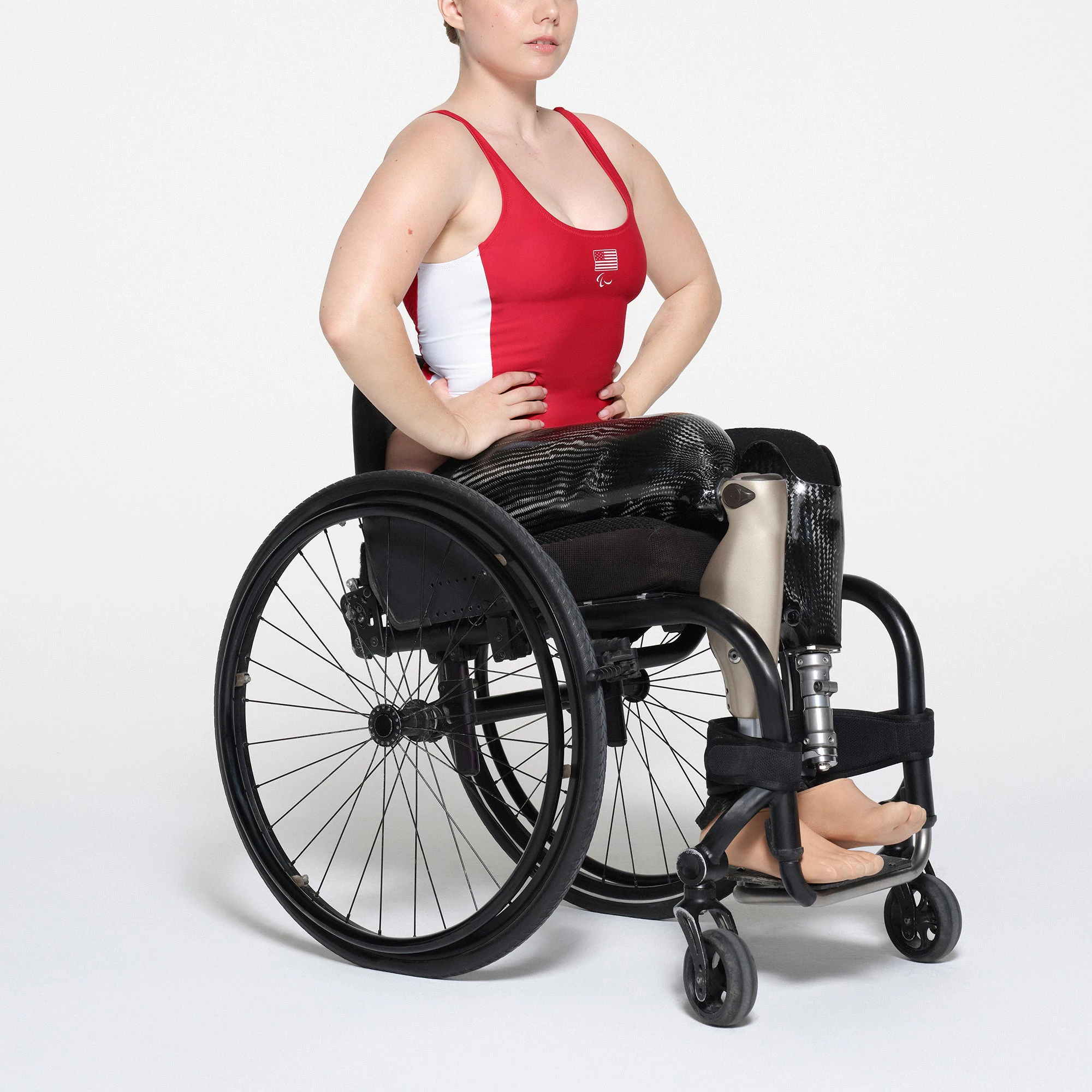 SKIMS FOR TEAM USA SIGNATURE SWIM PARALYMPIC SCOOP NECK ONE PIECE | RED ON A MODEL SIDE VIEW