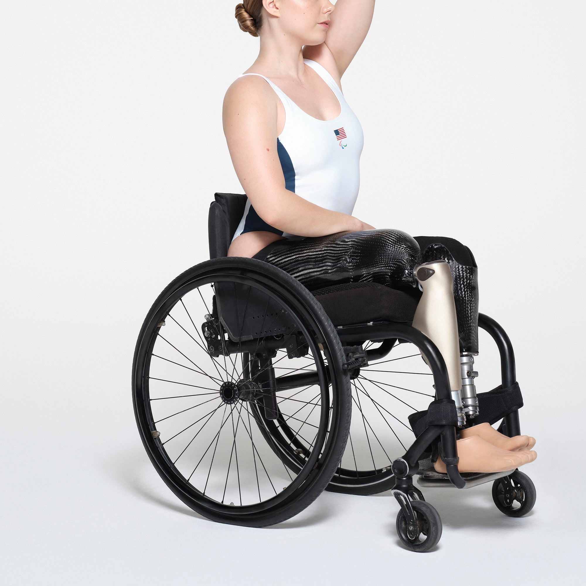 SKIMS FOR TEAM USA SIGNATURE SWIM PARALYMPIC SCOOP NECK ONE PIECE | WHITE ON A MODEL SIDE VIEW