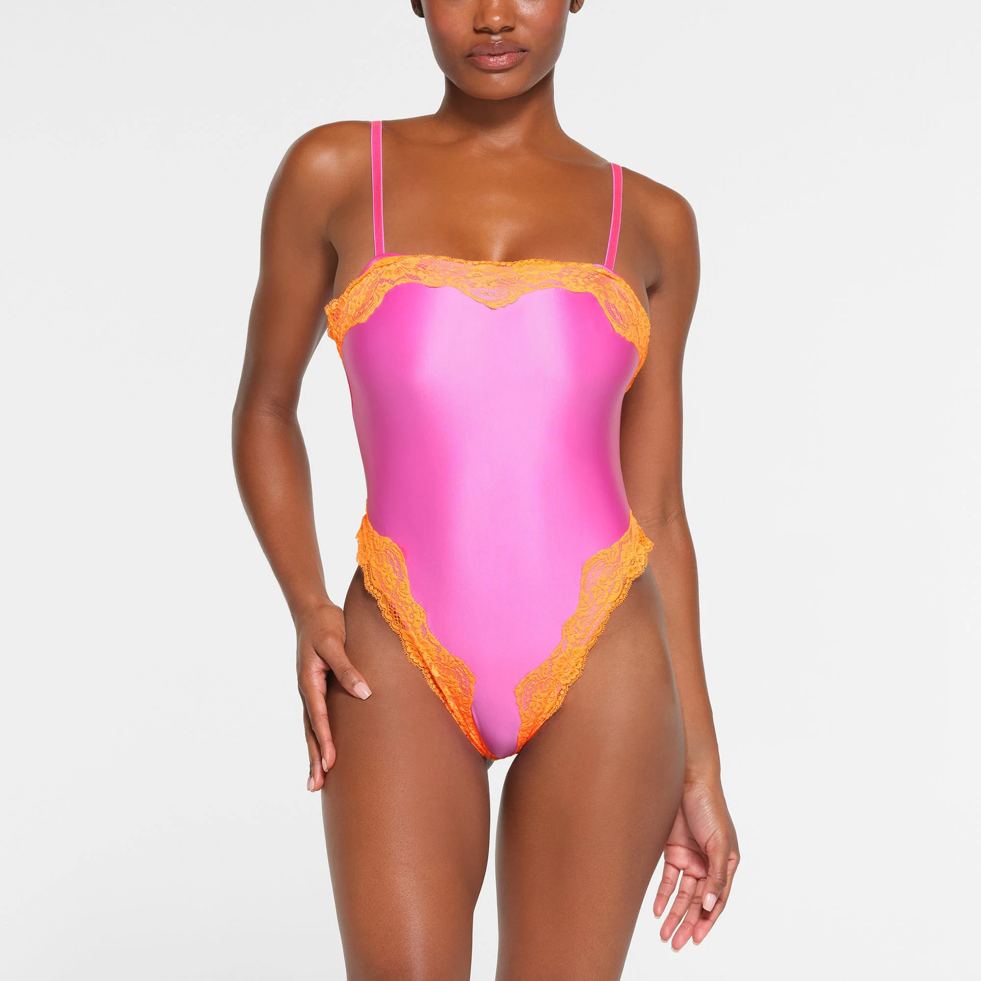 LACE SWIM CAMI ONE PIECE | NEON ORCHID ON A MODEL FRONT VIEW