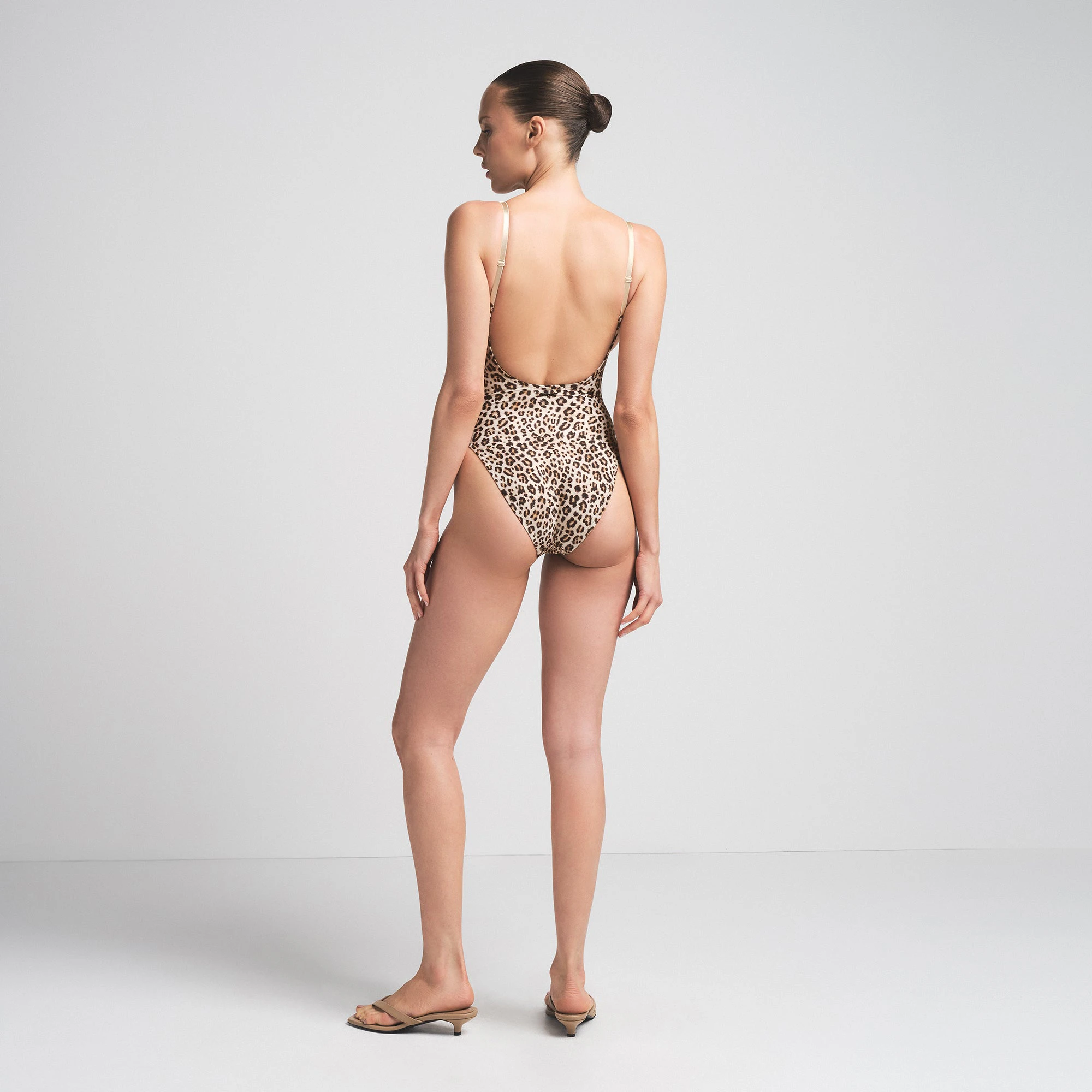 SIGNATURE SWIM SCOOP NECK ONE PIECE | CHAMPAGNE LEOPARD PRINT ON A MODEL SIDE VIEW | FOCUS: 0.0, 1.0, 0.9