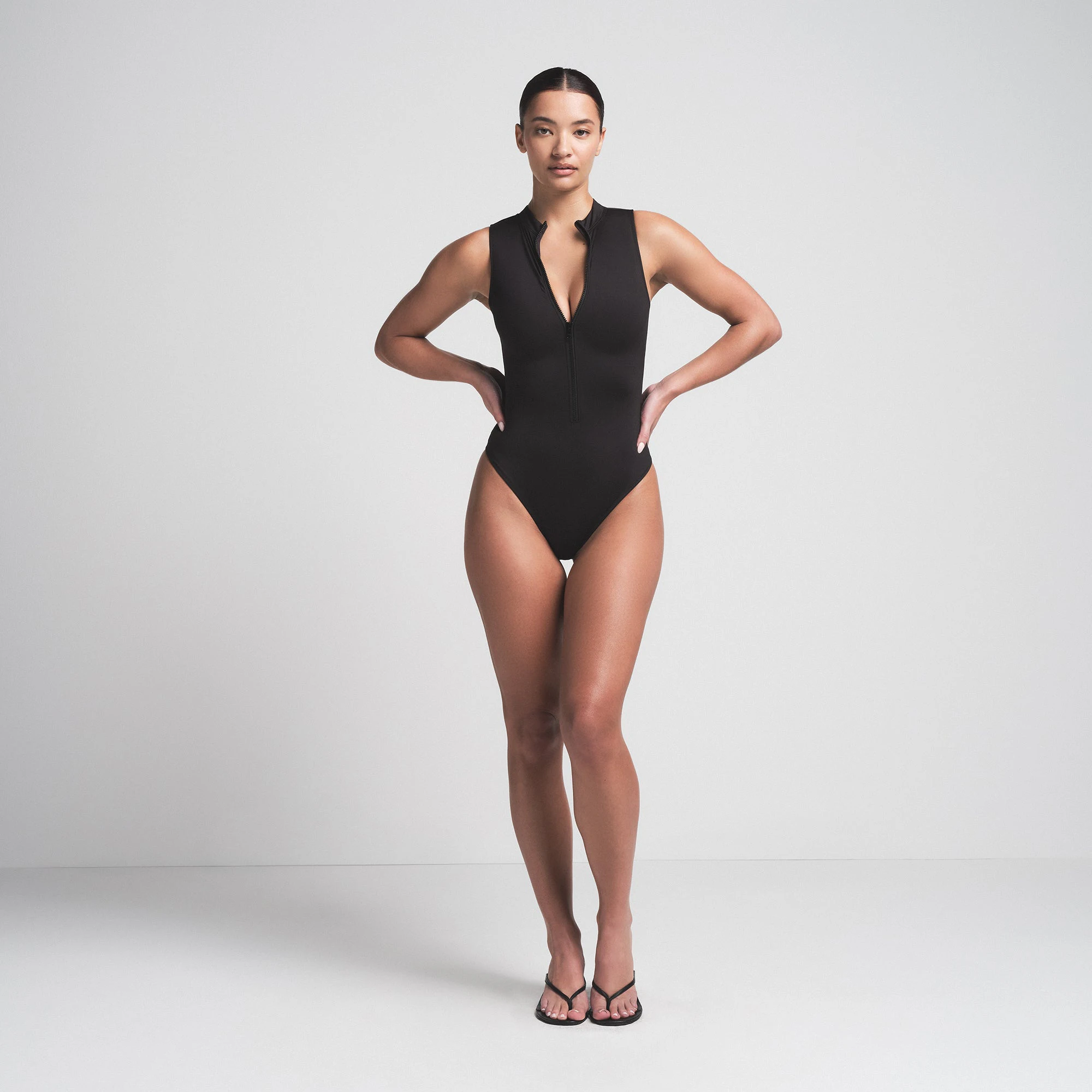 SIGNATURE SWIM ZIP FRONT ONE PIECE | ONYX ON A MODEL FRONT VIEW | FOCUS: 0.0, 1.0, 0.9