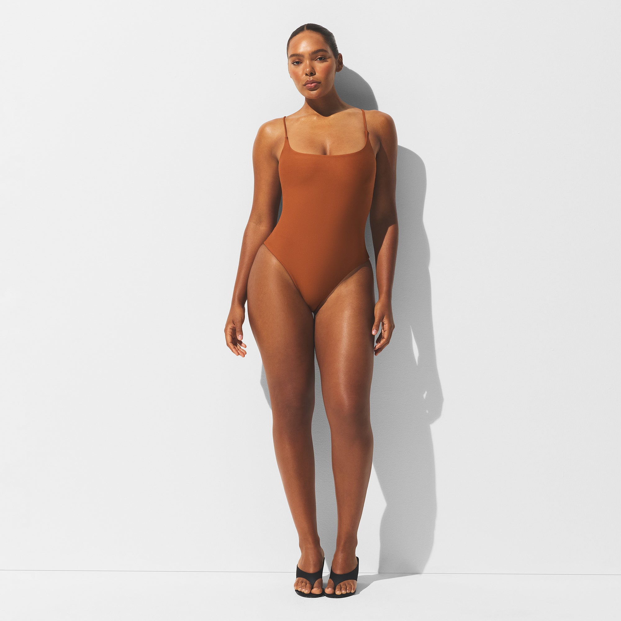 MINIMAL SWIM SQUARE NECK ONE PIECE | BRONZE ON A MODEL FRONT VIEW | FOCUS: 0.0, 1.0, 0.9
