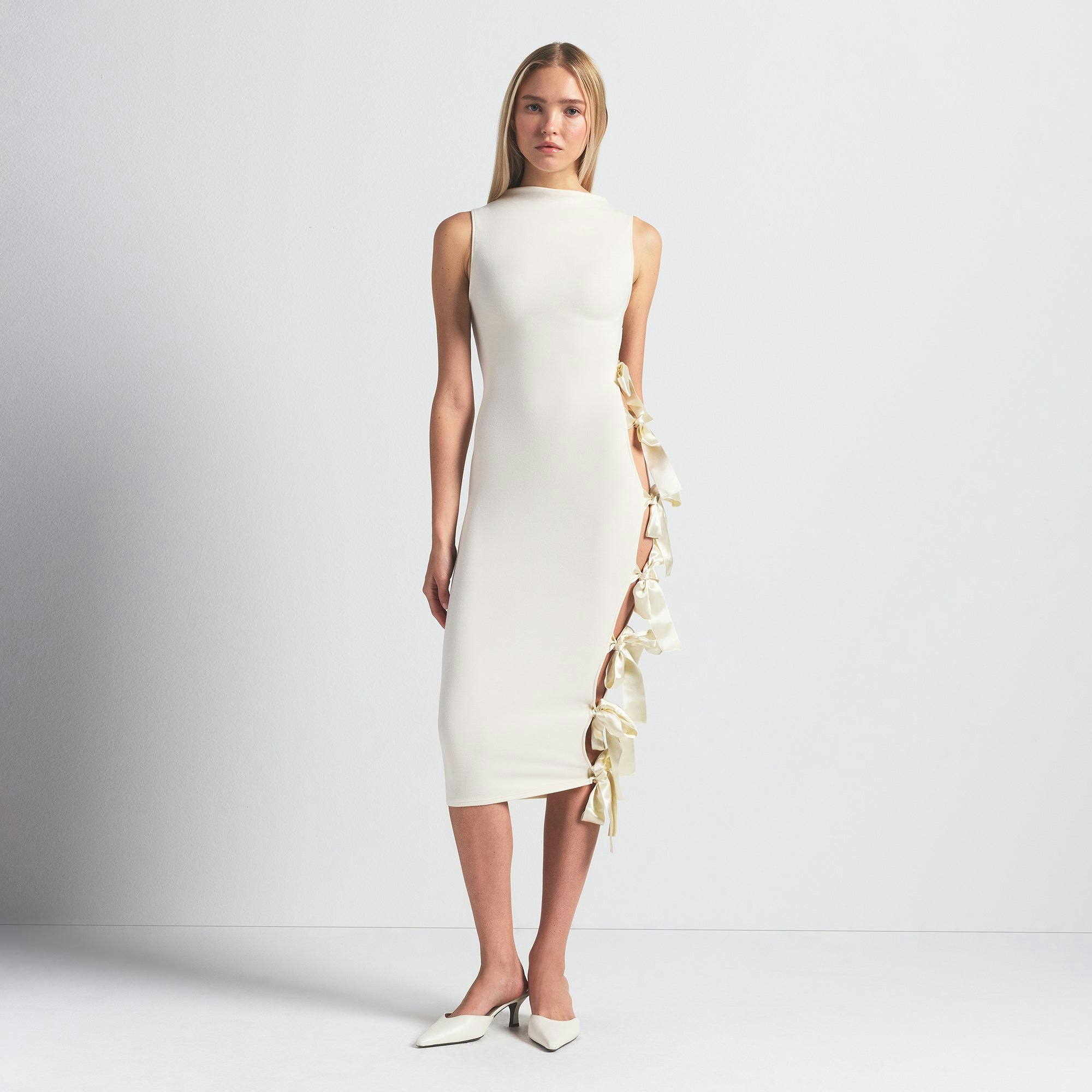 SKIMS CLOUD BOW DRESS | ECRU ON A MODEL FRONT VIEW @ | FOCUS: 0.0, 1.0, 0.9