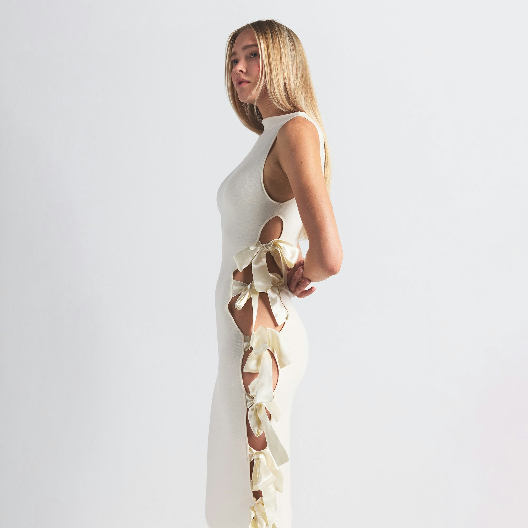 SKIMS CLOUD BOW DRESS | ECRU ON A MODEL SIDE VIEW @ | FOCUS: 0.0, 1.0, 0.9