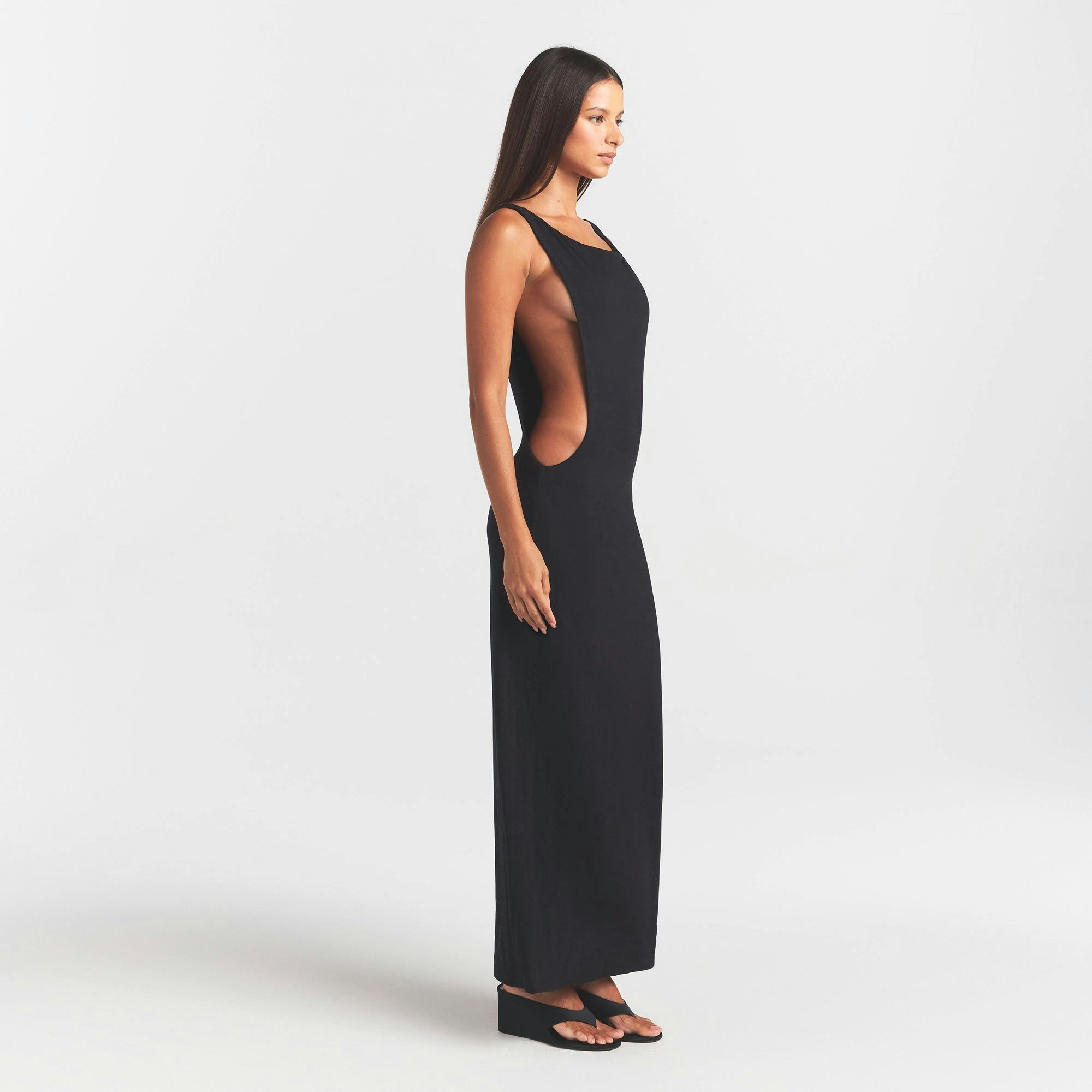 SMOOTH LAYERS CUT OUT LONG DRESS | OBSIDIAN ON A MODEL FRONT VIEW @ | FOCUS: 0.0, 1.0, 0.9