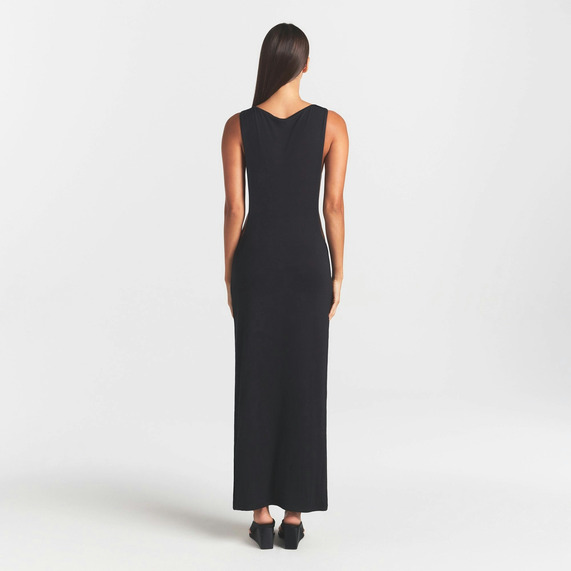 SMOOTH LAYERS CUT OUT LONG DRESS | OBSIDIAN ON A MODEL FRONT VIEW @ | FOCUS: 0.0, 1.0, 0.9