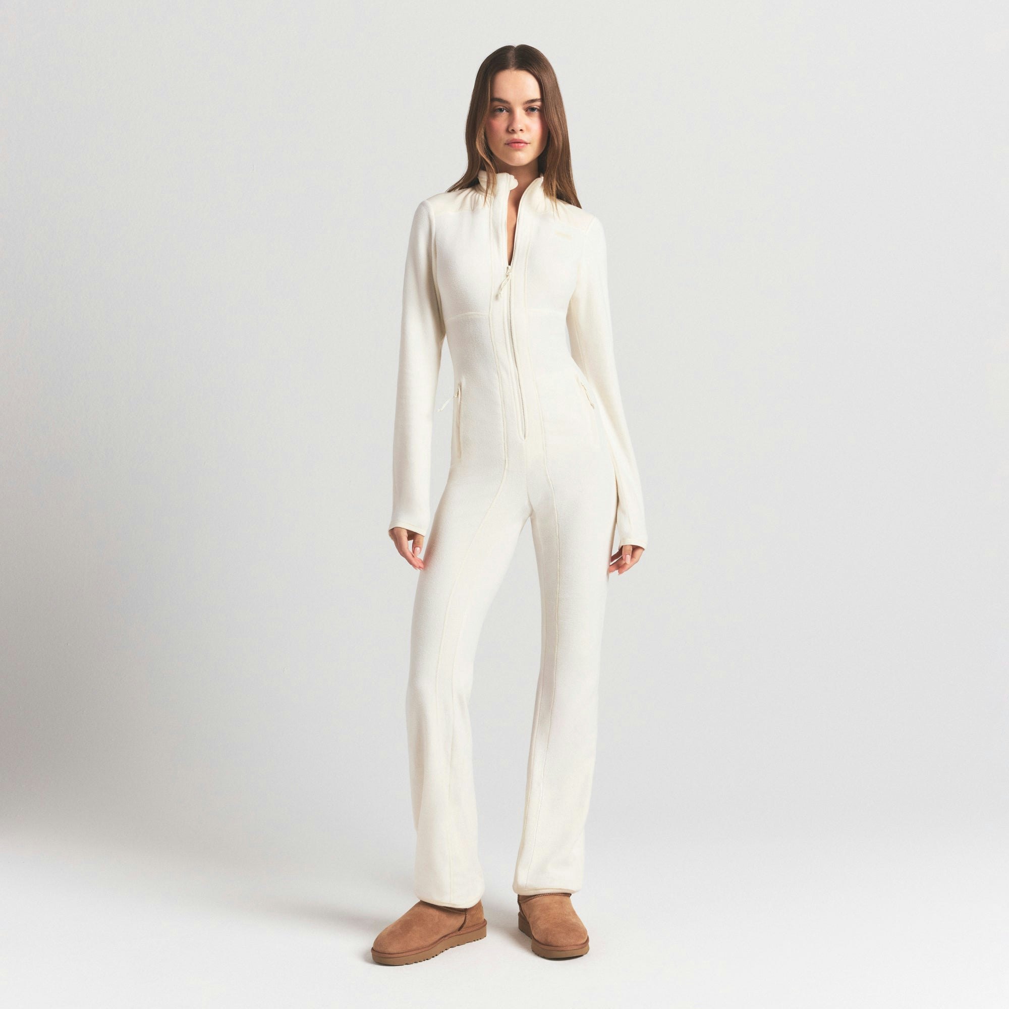OUTDOOR FLEECE CATSUIT | ECRU ON A MODEL FRONT VIEW @ | FOCUS: 0.0, 1.0, 0.9