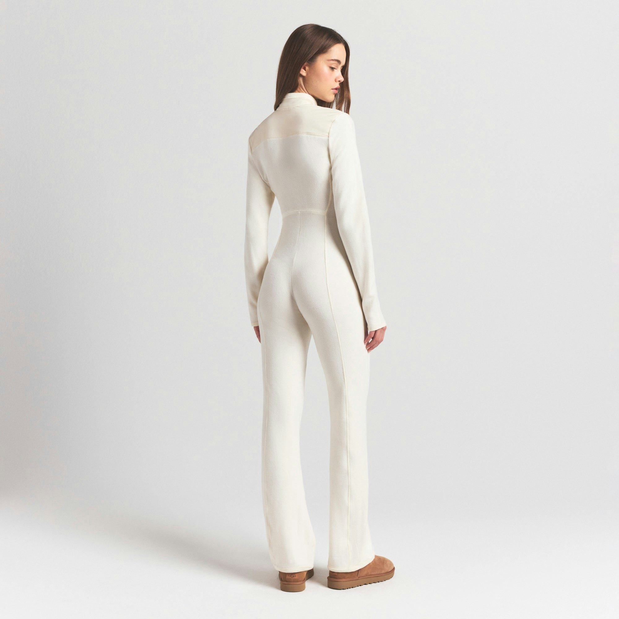 OUTDOOR FLEECE CATSUIT | ECRU ON A MODEL SIDE VIEW @ | FOCUS: 0.0, 1.0, 0.9