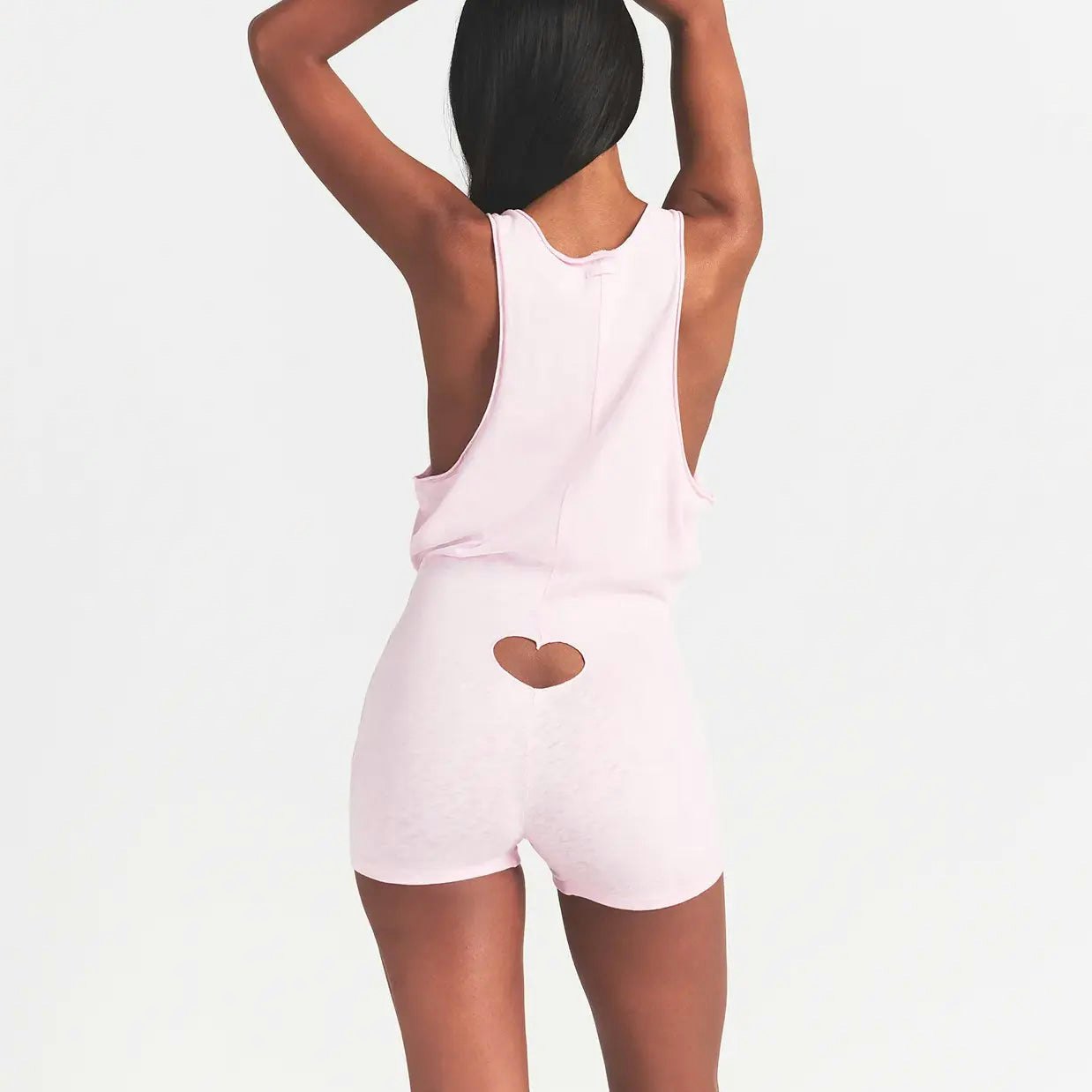 WORN IN JERSEY HEART ONESIE | BABY PINK ON A MODEL BACK VIEW @ | FOCUS: 0.0, 1.0, 0.9